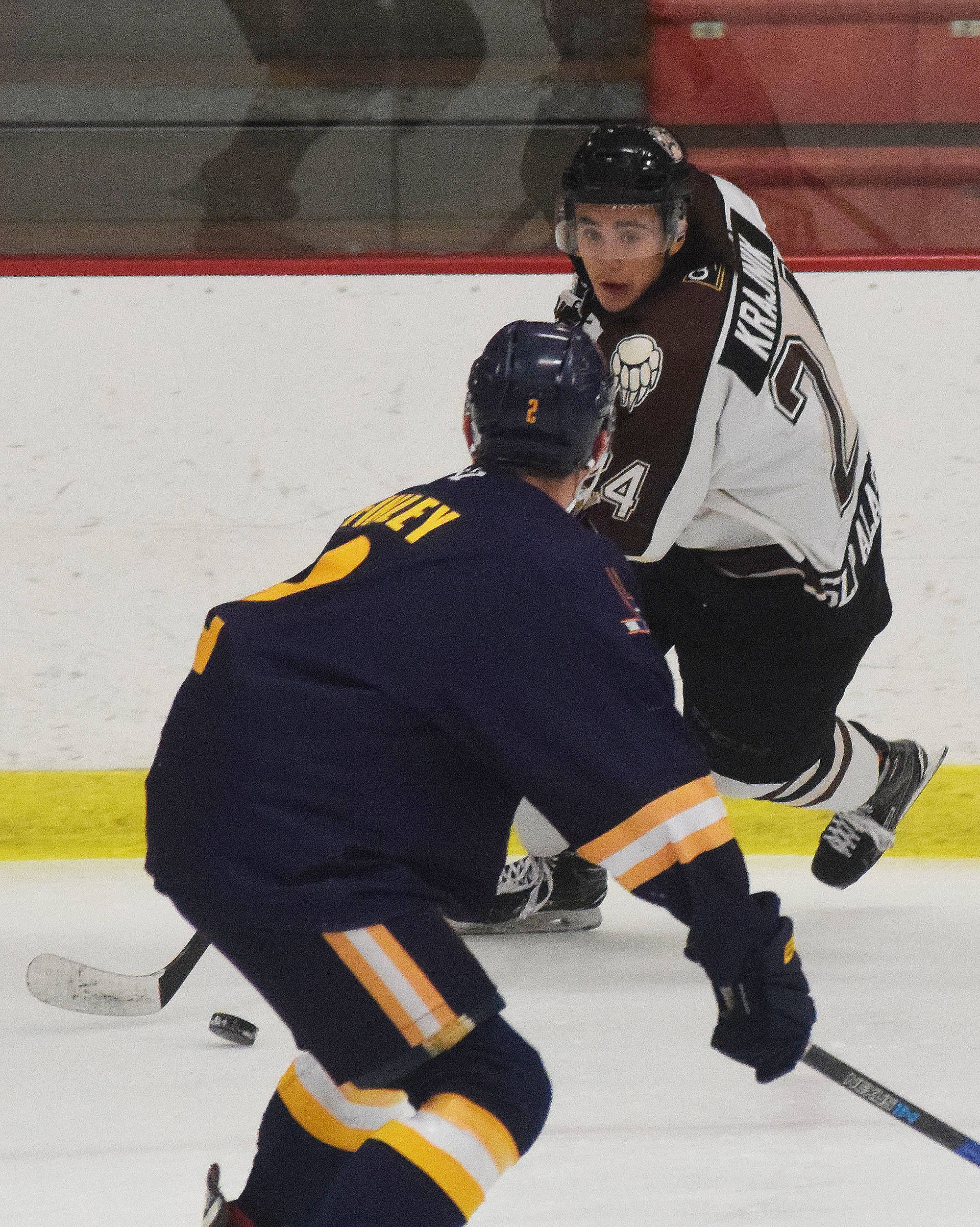 Kenai River’s Zach Krajnik looks for a way around Springfield’s Blake Finley (front) Thursday night in a North American Hockey League contest against the Springfield (Illinois) Jr. Blues at the Soldotna Regional Sports Complex. (Photo by Joey Klecka/Peninsula Clarion)