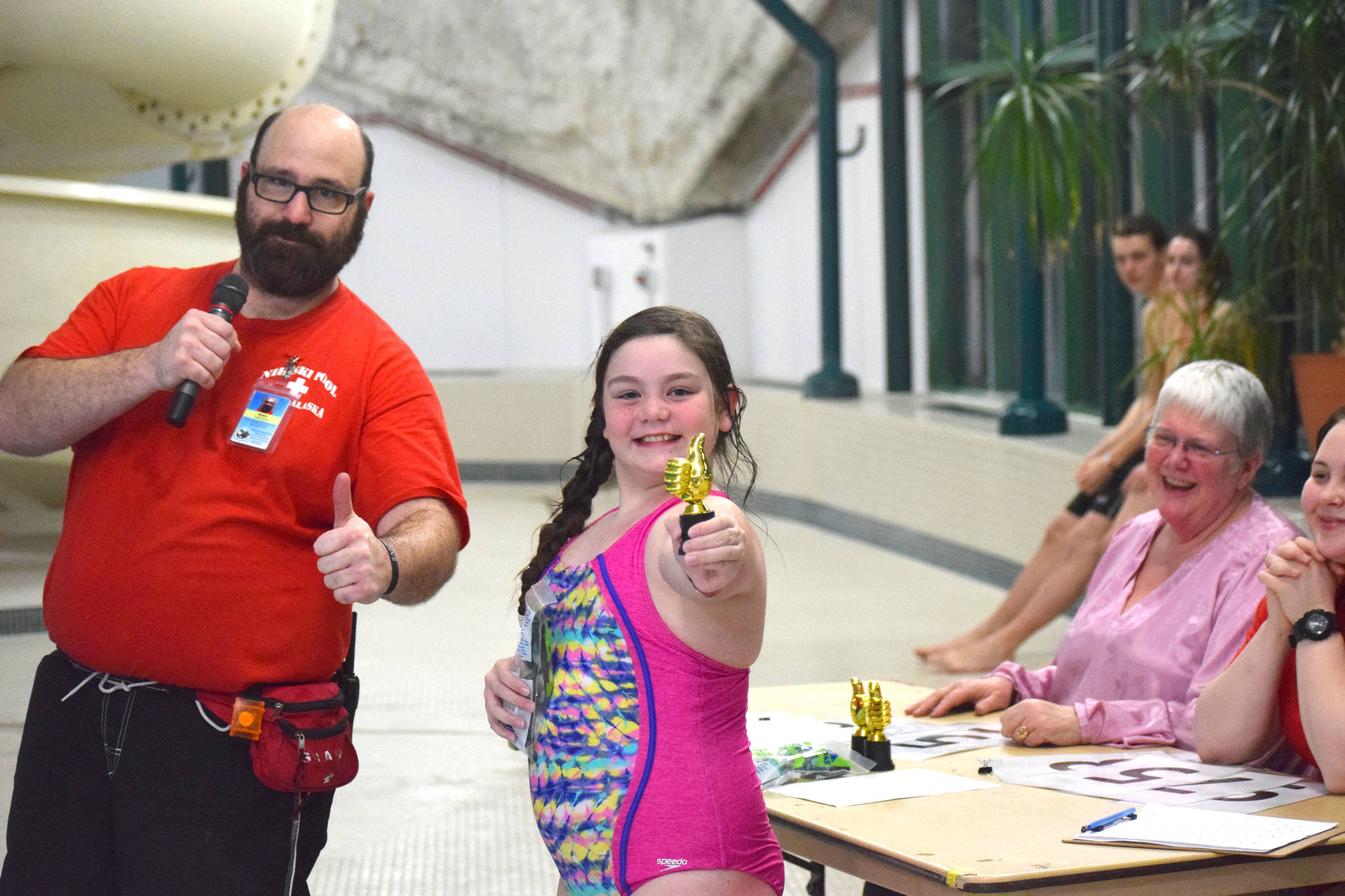 One of the winners of the cannonball contest at the Nikiski Pool poses with her trophy on Thursday, Jan. 17, 2019. (Photo by Brian Mazurek/Peninsula Clarion)