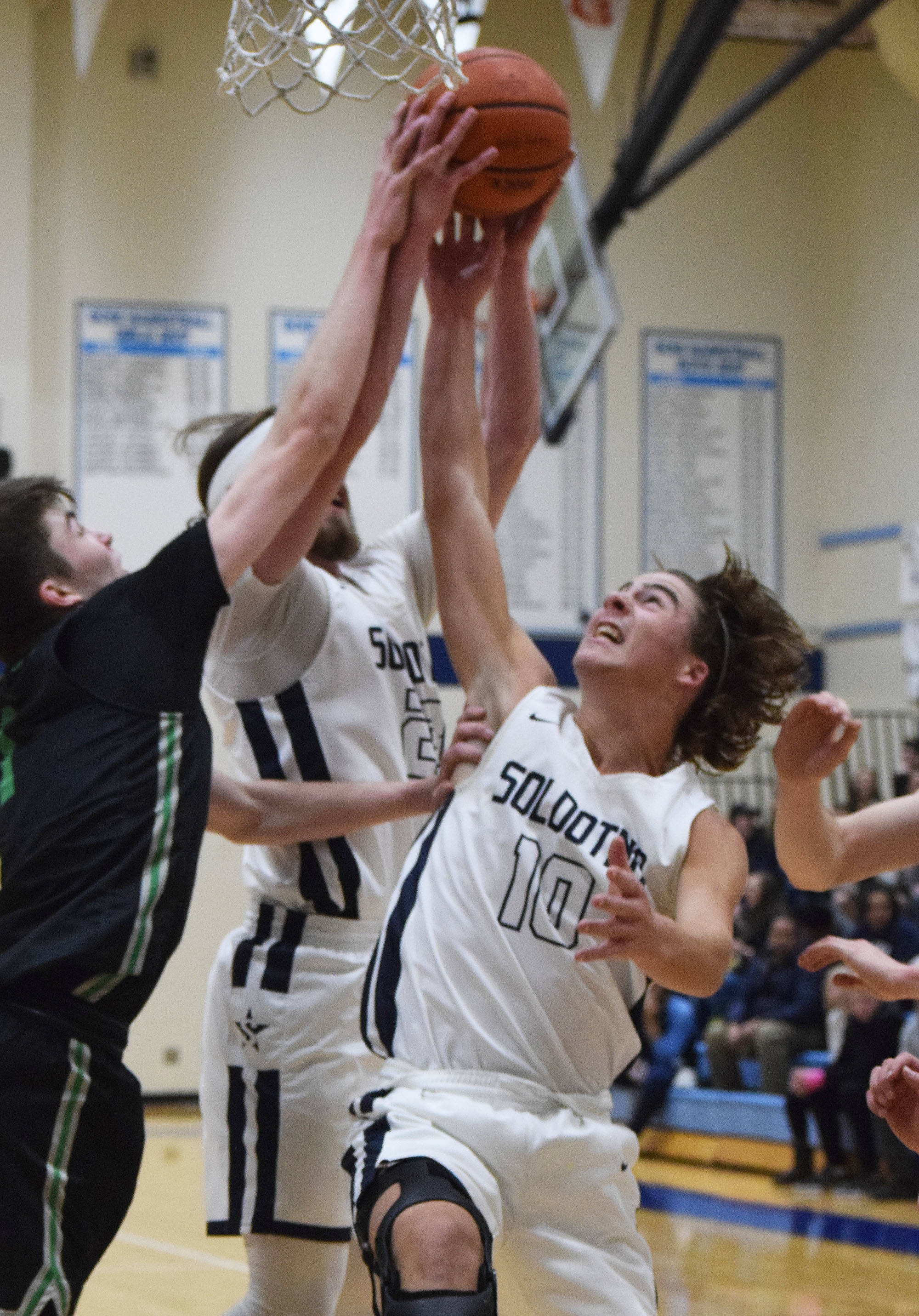 Soldotna’s Zach Hanson (10) competes for a rebound Friday night against Colony at Soldotna High School. (Photo by Joey Klecka/Peninsula Clarion)