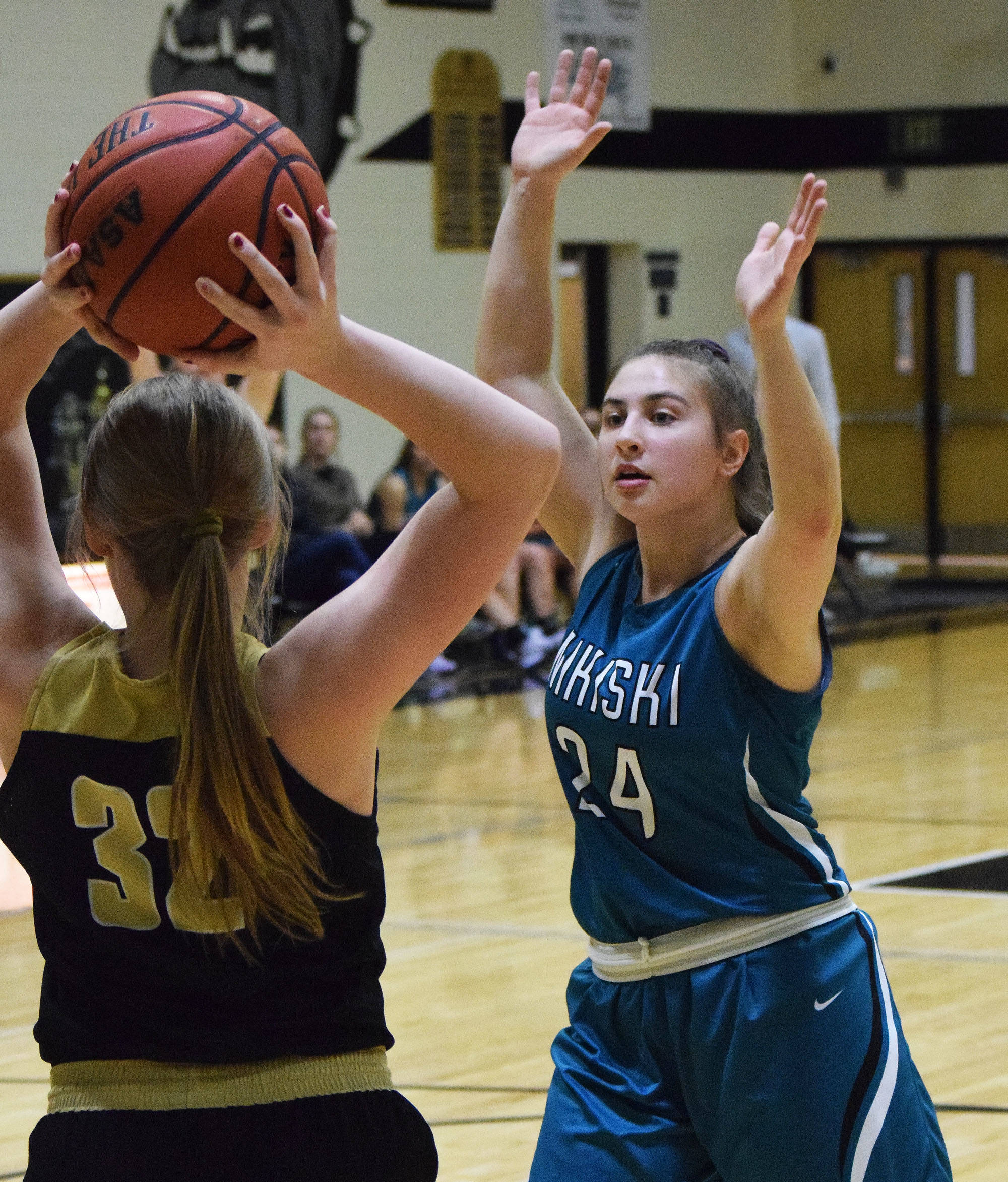 Nikiski’s Kelsey Clark (24) defends an inbound pass from South’s Lily Weimann Saturday at the Rus Hitchcock Nikiski Tip Off tournament. (Photo by Joey Klecka/Peninsula Clarion)