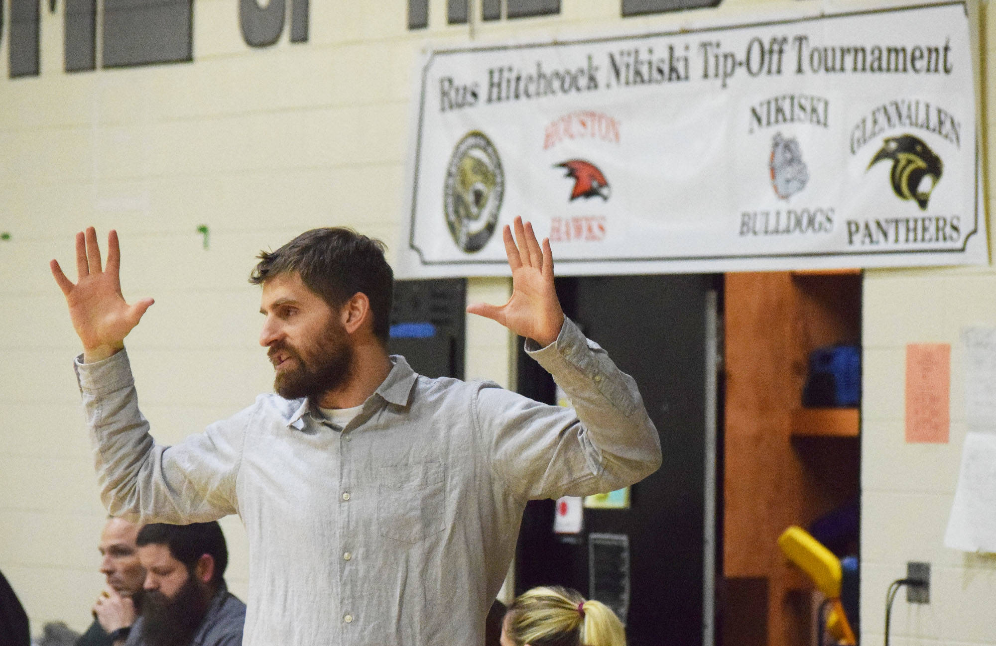 Nikiski girls head coach Rustin Hitchcock guides the Bulldogs from the bench Saturday at the Rus Hitchcock Nikiski Tip Off tournament. The names of the tournament honors Hitchcock’s late father, who passed away in Oct. 2017 to a heart attack. (Photo by Joey Klecka/Peninsula Clarion)