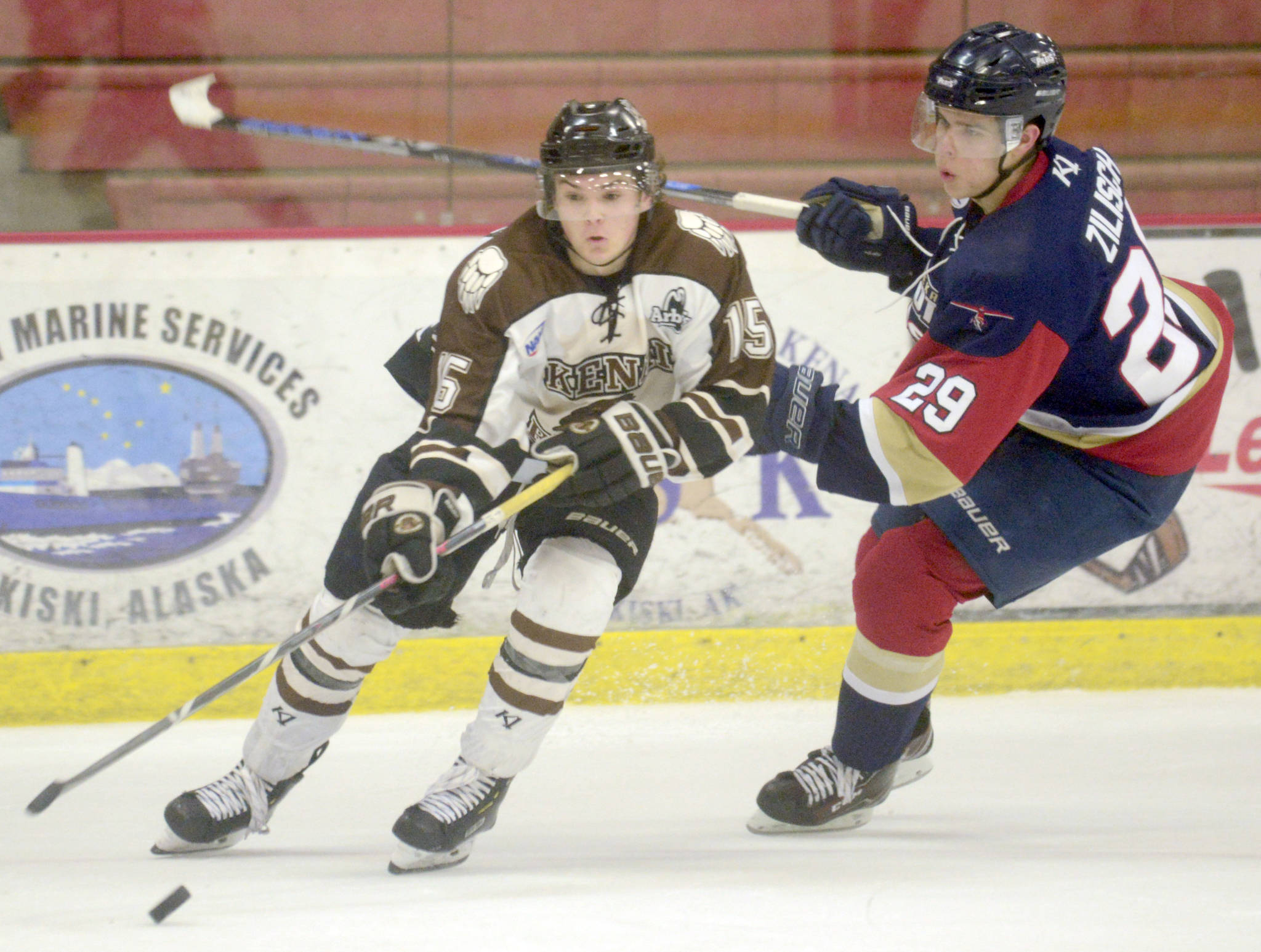 Kenai River Brown Bears forward Cody Moline keeps the puck from Topeka (Kansas) Pilots forward Connor Zilisch on Friday, Feb. 1, 2019, at the Soldotna Regional Sports Complex. (Photo by Jeff Helminiak/Peninsula Clarion)