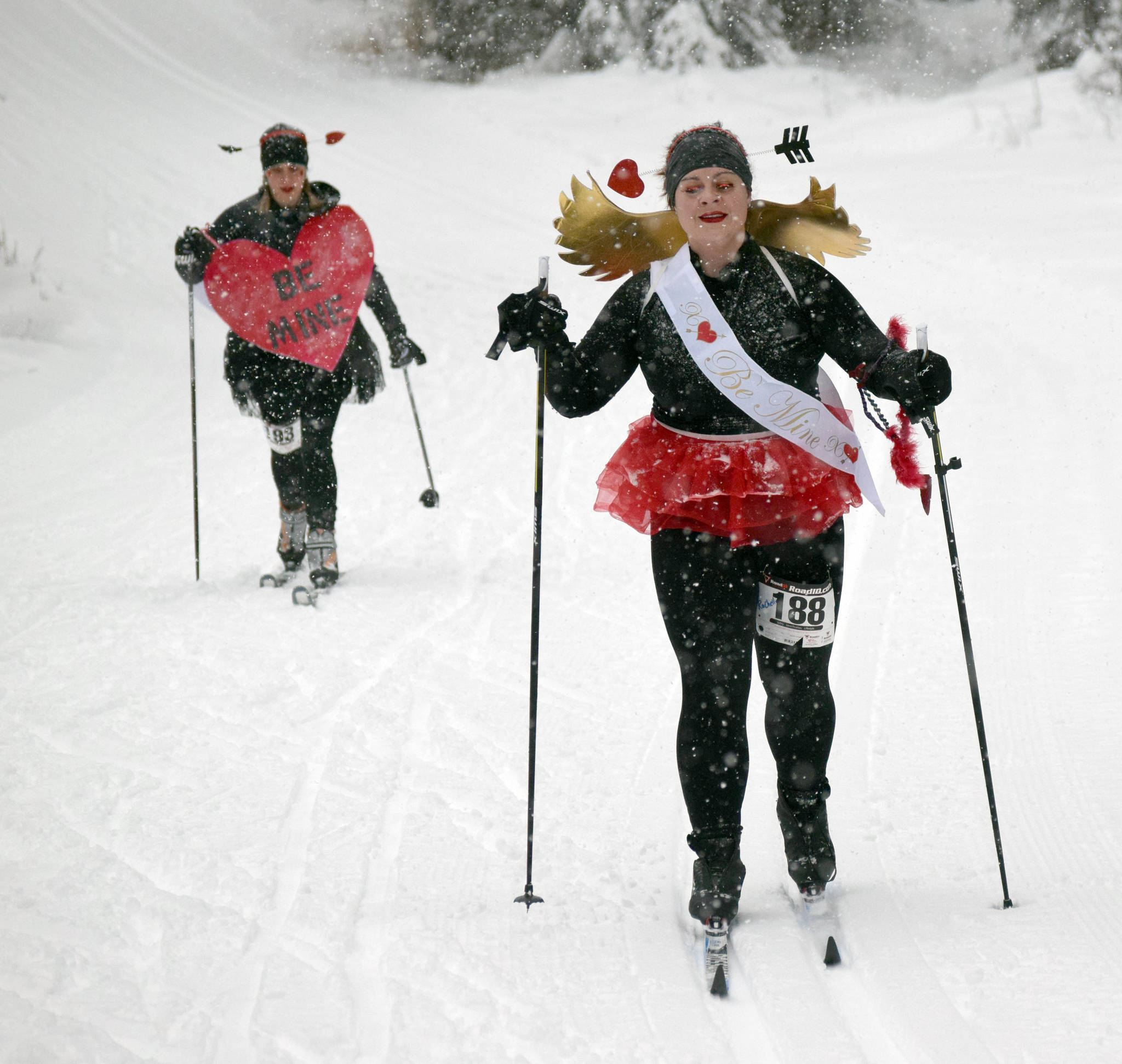 Sara Bundy (left) and RaChelle Gruenberg were awarded best costume at the Ski for Women on Sunday, Feb. 3, 2019, at Tsalteshi Trails. (Photo by Jeff Helminiak/Peninsula Clarion)