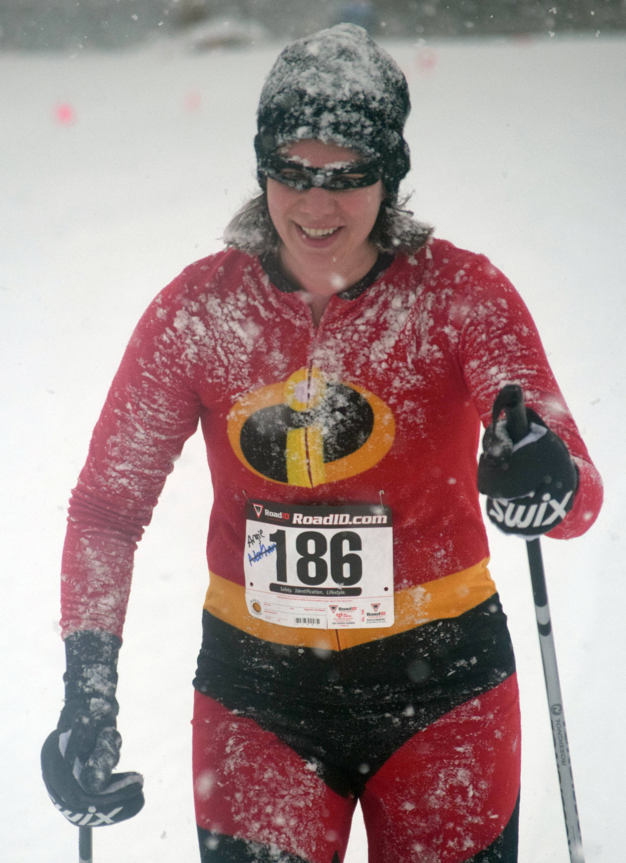 Angie Nelson is carpeted with snow near the finish of the Ski for Women on Sunday, Feb. 3, 2019, at Tsalteshi Trails. (Photo by Jeff Helminiak/Peninsula Clarion)