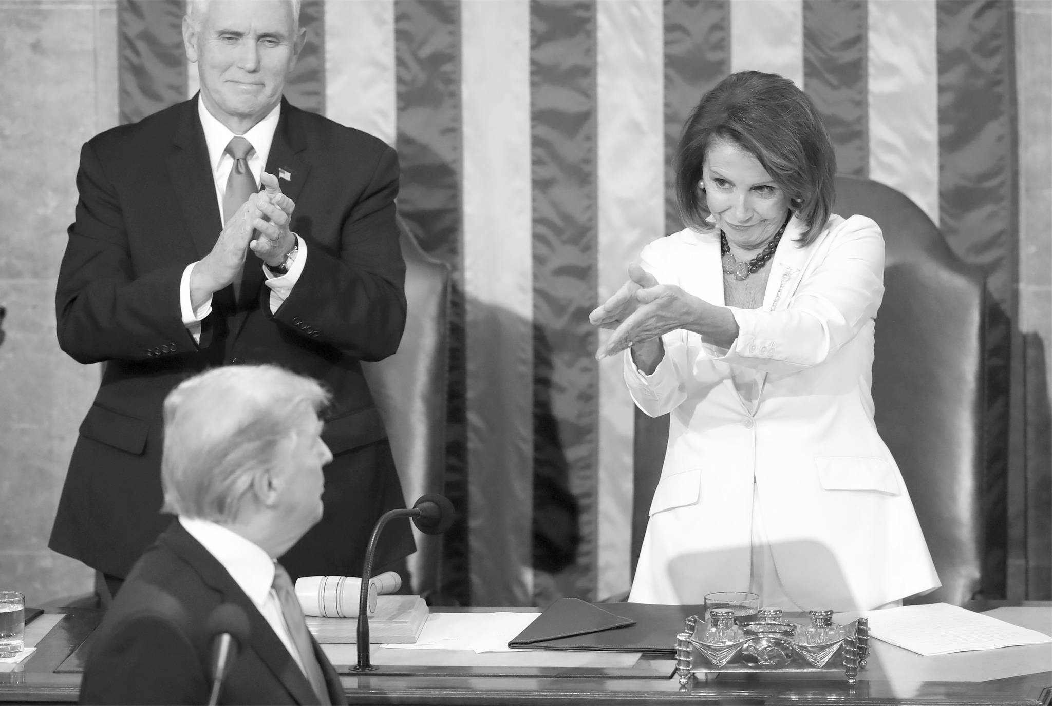 President Donald Trump turns to House speaker Nancy Pelosi of Calif., as he delivers his State of the Union address to a joint session of Congress on Capitol Hill in Washington, as Vice President Mike Pence watches, Tuesday. (AP Photo/Andrew Harnik)