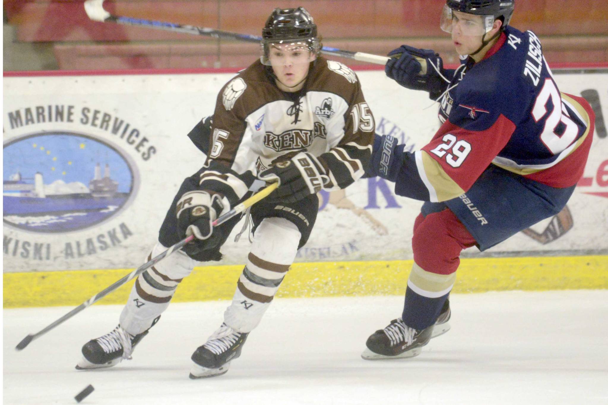 Kenai River Brown Bears forward Cody Moline keeps the puck from Topeka (Kansas) Pilots forward Connor Zilisch on Friday, Feb. 1, 2019, at the Soldotna Regional Sports Complex. (Photo by Jeff Helminiak/Peninsula Clarion)