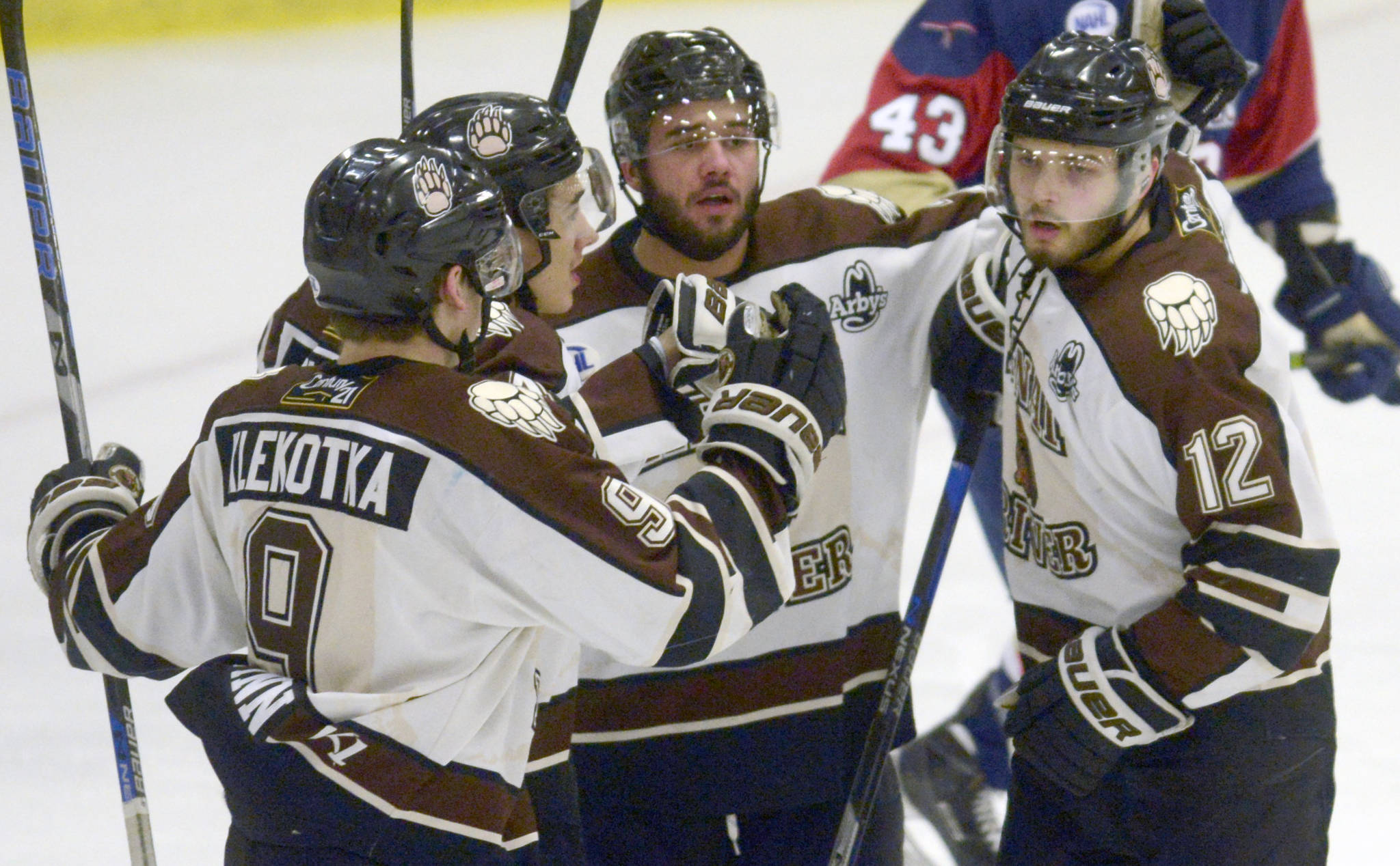 Trey LaBarge (far right) celebrates his first-period goal against the Topeka (Kansas) Pilots with teammates Friday, Feb. 1, 2019, at the Soldotna Regional Sports Complex. (Photo by Jeff Helminiak/Peninsula Clarion)