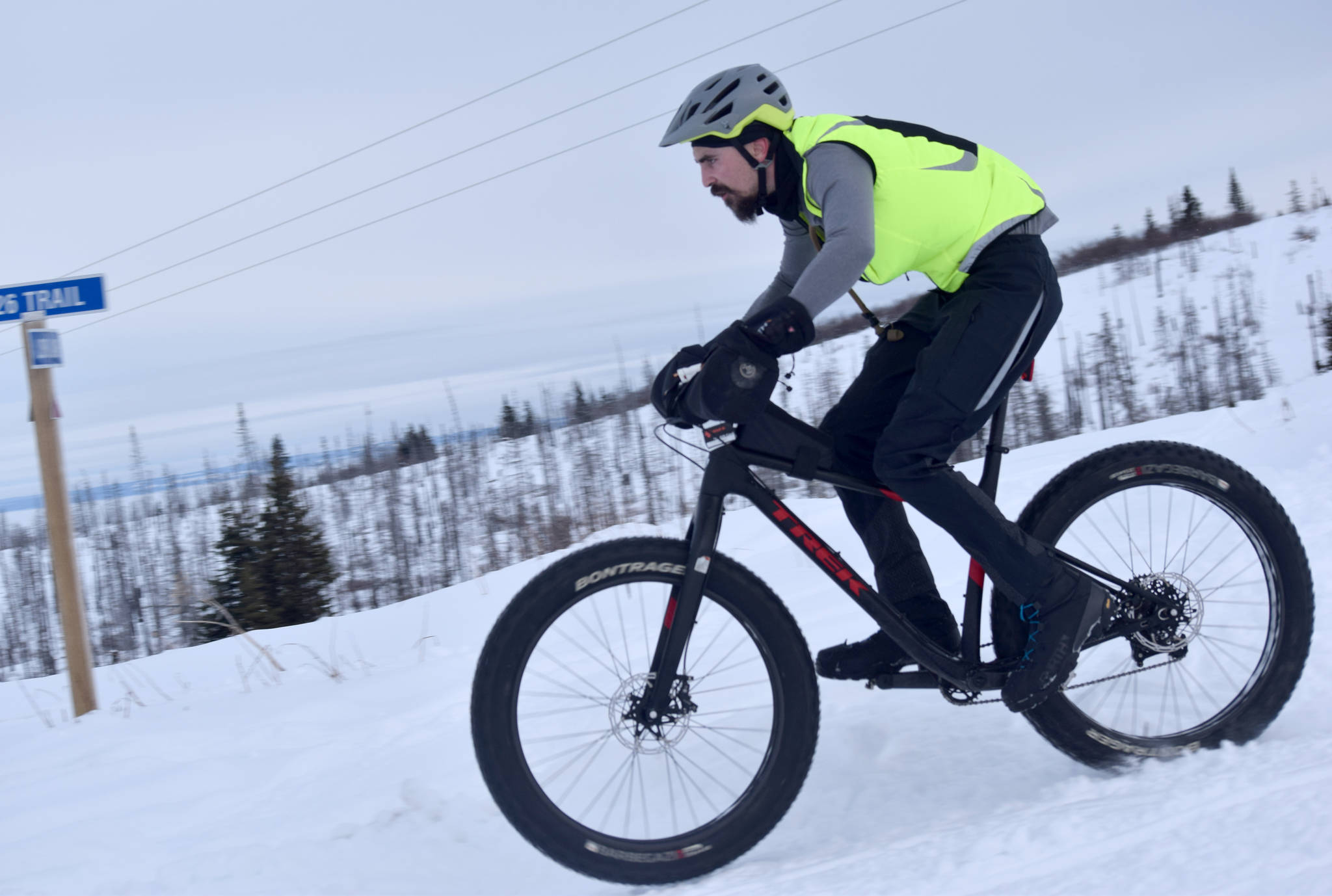 Nathan Kincaid flies down a hill during Fat Freddie’s Bike Race and Ramble on Feb. 9, 2019, in the Caribou Hills near Freddie’s Roadhouse. (Photo by Jeff Helminiak/Peninsula Clarion)