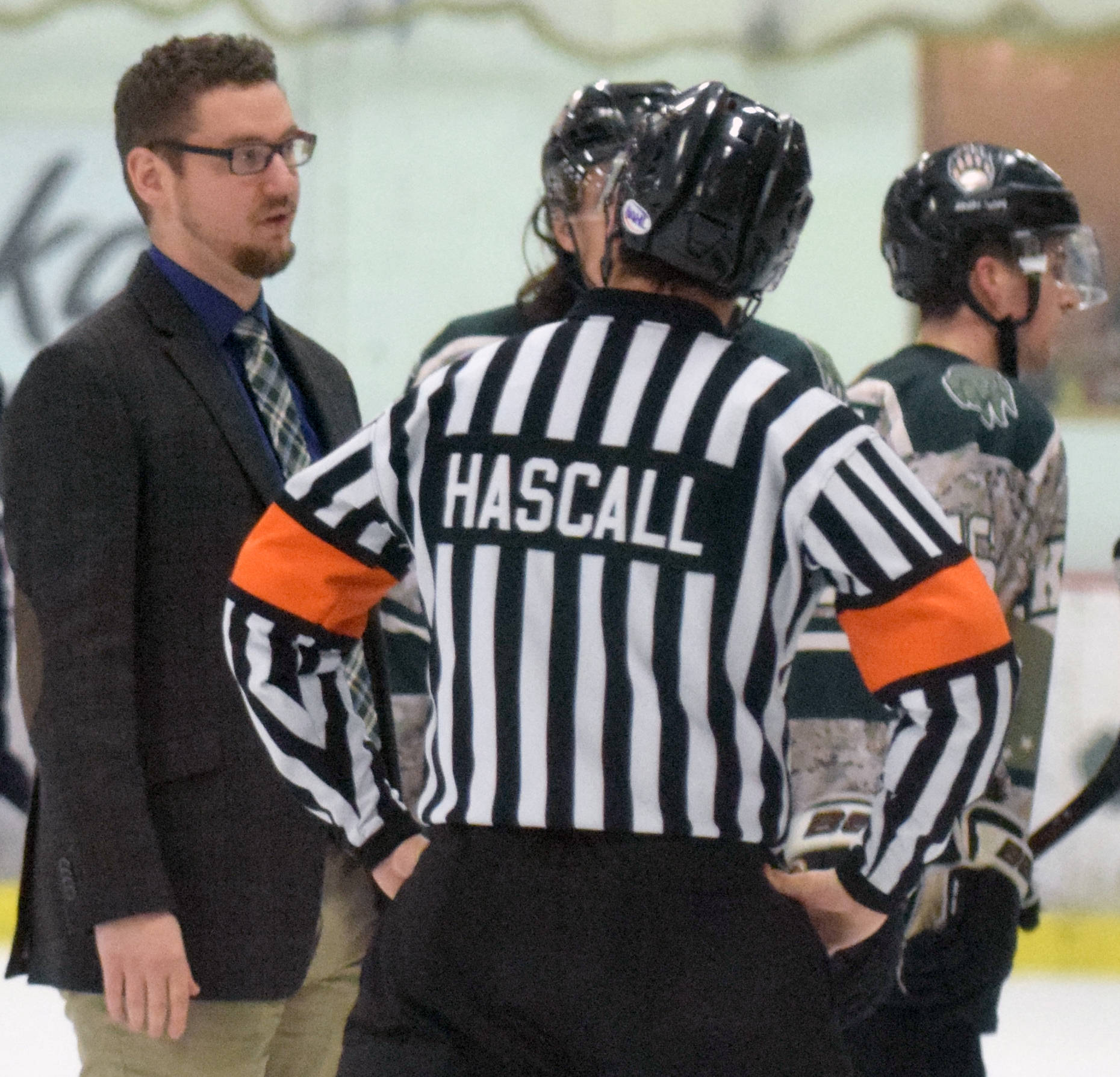 Kenai River Brown Bears head coach Josh Petrich has a discussion with a referee at the Soldotna Regional Sports Complex on Friday, Jan. 11, 2019. (Photo by Jeff Helminiak/Peninsula Clarion)