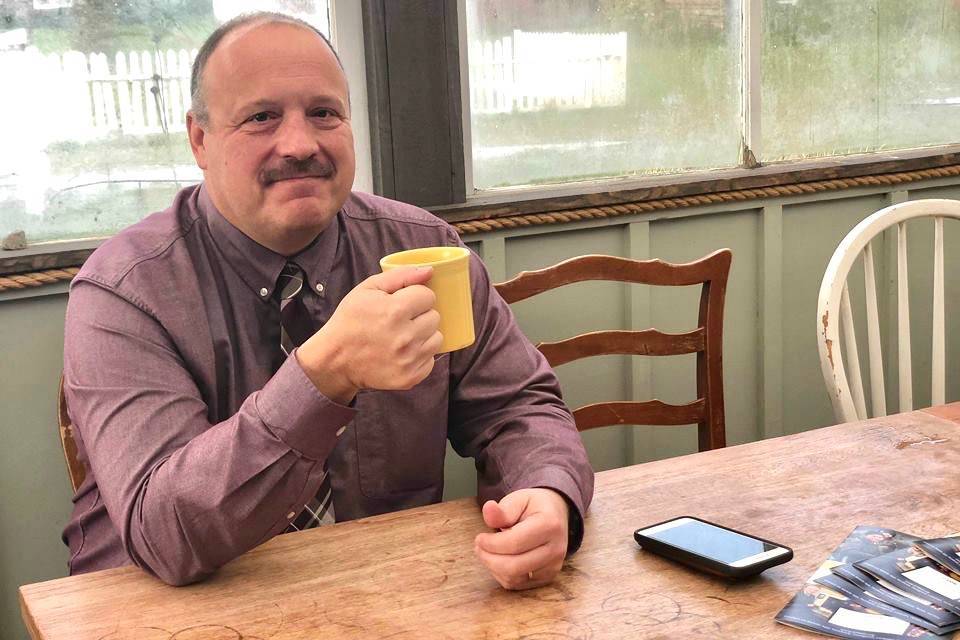 Kenai Peninsula Borough School District Superintendent Sean Dusek waits to talk and answer the public’s questions in the back room of Veronica’s Cafe in Kenai on Friday. (Photo by Victoria Petersen/Peninsula Clarion)