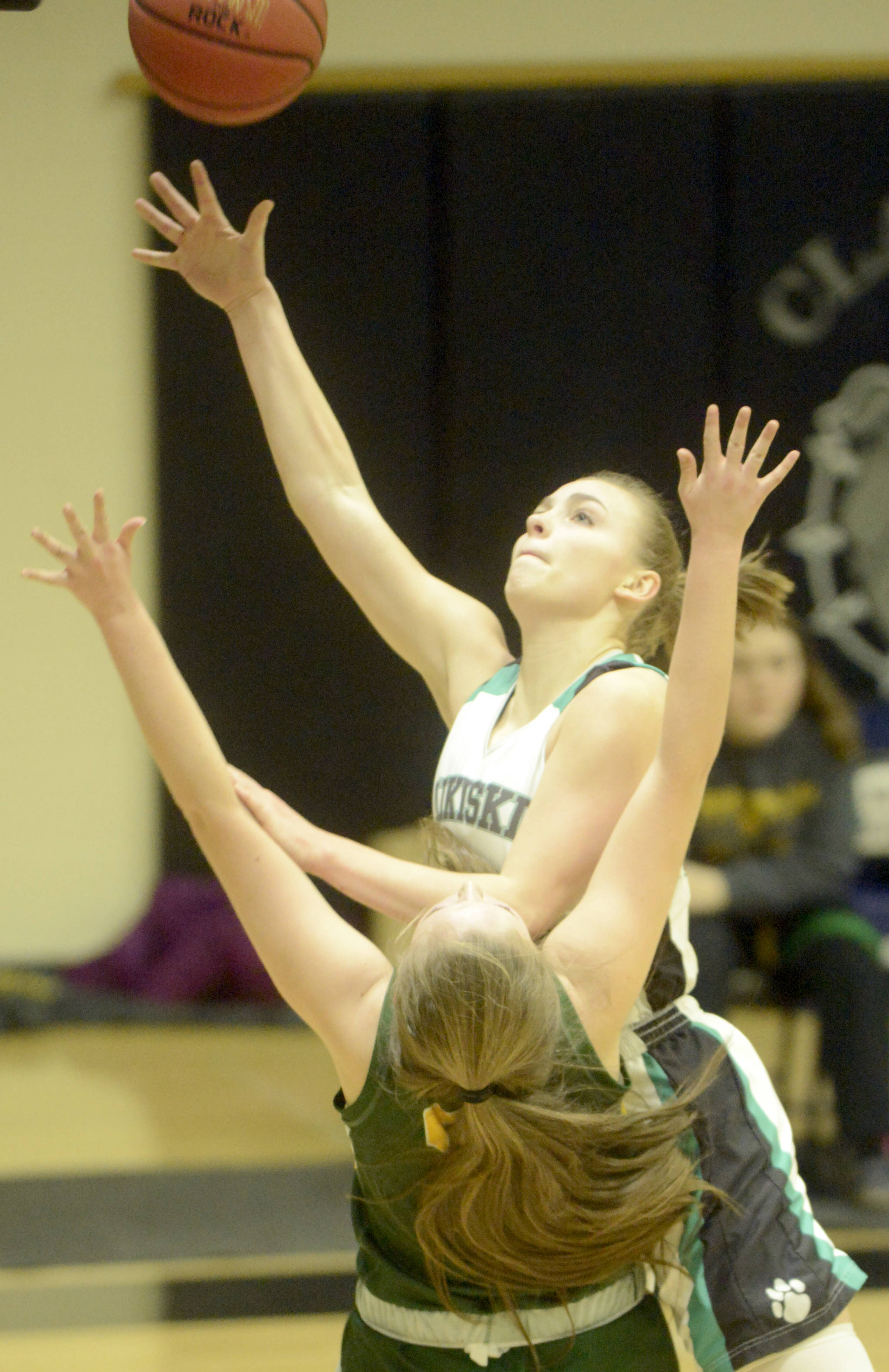 Nikiski’s Bethany Carstens shoots over Seward’s Sequoia Sieverts on Friday, Feb. 15, 2019, at Nikiski High School. (Photo by Jeff Helminiak/Peninsula Clarion)