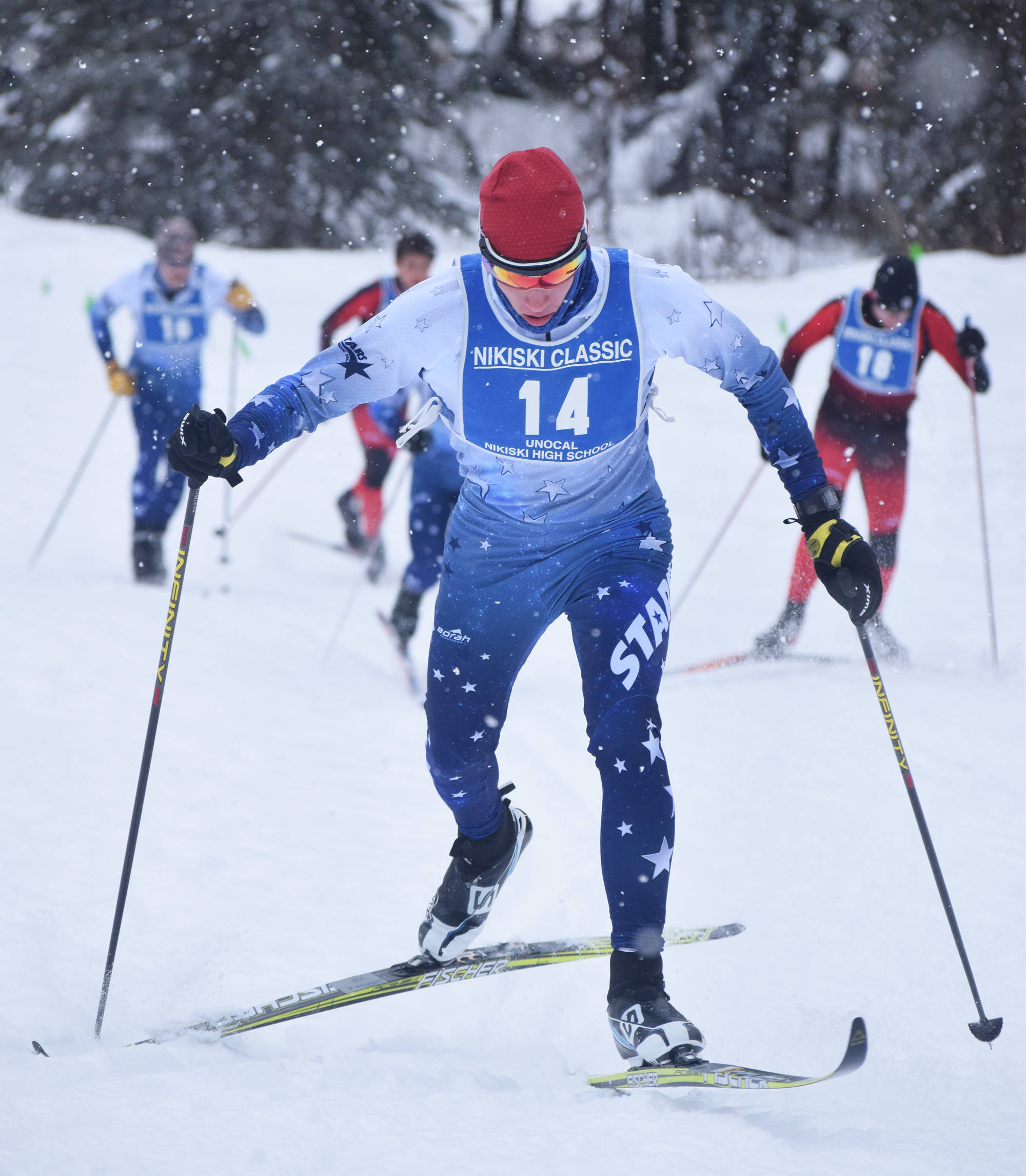 Soldotna’s Jeremy Kupferschmid powers his way up a hill early in Saturday’s boys relay at the Kenai Peninsula Borough nordic ski meet at the Tsalteshi Trails in Soldotna. (Photo by Joey Klecka/Peninsula Clarion)