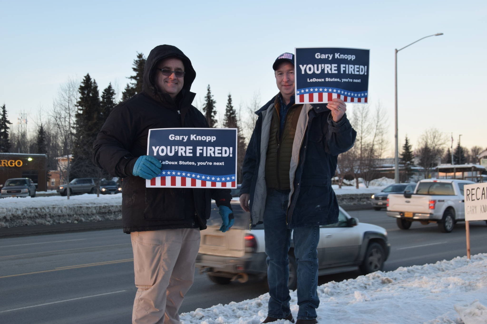 Protestors stand outside the town hall hosted by Rep. Gary Knopp, R- Soldotna at the Kenai River Suites in Soldotna on Feb. 15, 2019. (Photo by Brian Mazurek/Peninsula Clarion)