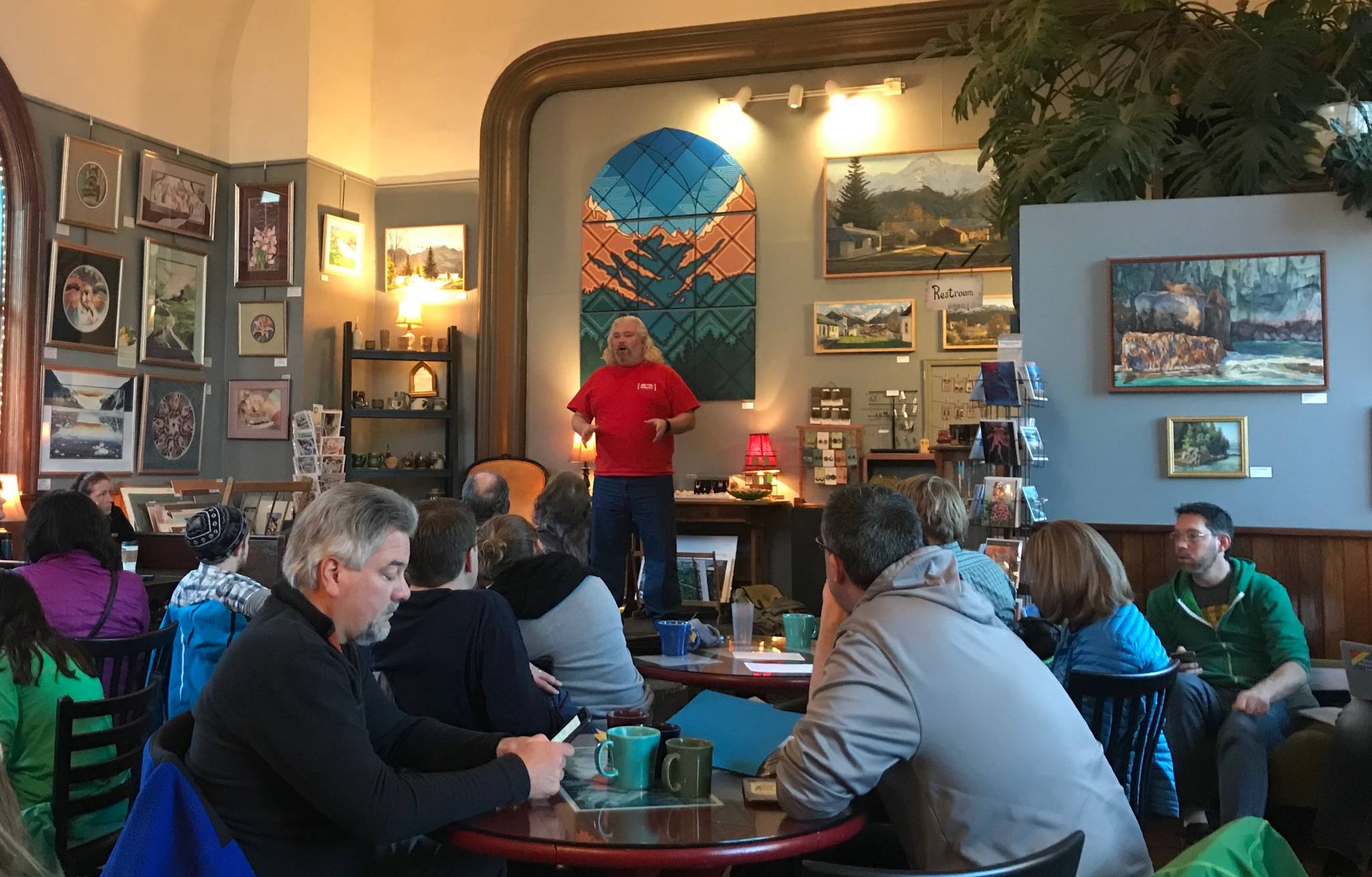 KPEA President David Brighton speaks to a group of educators, community members and district employees at Resurrect Art Coffee House on Friday, in Seward. (Photo by Kat Sorensen/Peninsula Clarion)