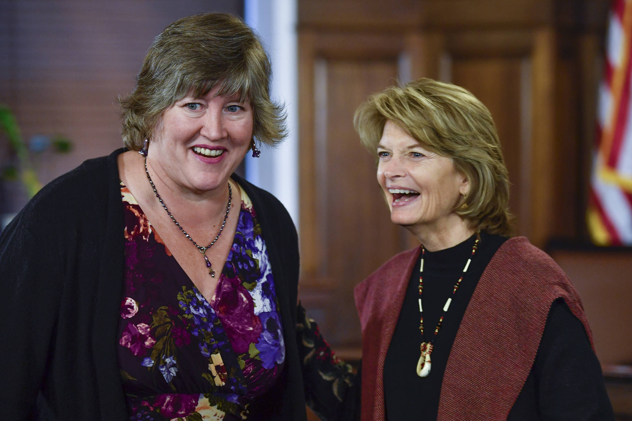 Rep. Sara Hannan, D-Juneau, shares a laugh with U.S. Sen. Lisa Murkowski, R-Alaska, after Murkowski gave her annual speech to a Joint Session of the Alaska Legislature at the Capitol on Tuesday, Feb. 19, 2019. (Michael Penn | Juneau Empire)