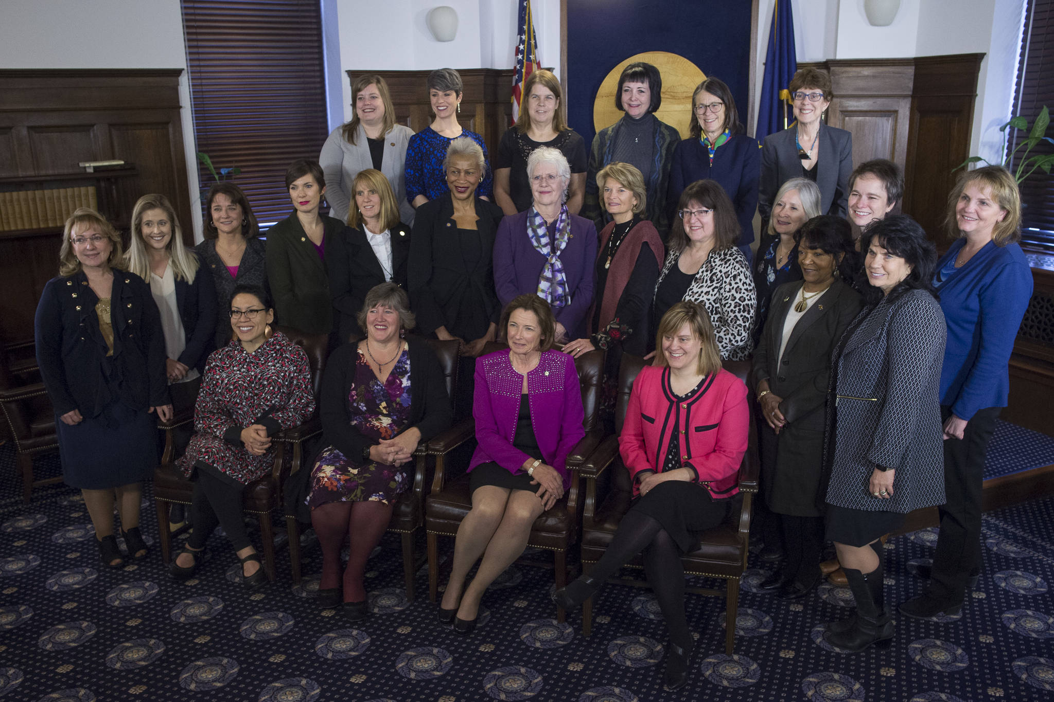 Twenty-three women legislators pose for a picture with U.S. Sen. Lisa Murkowski, R-Alaska, after Murkowski gave her annual speech to a Joint Session of the Alaska Legislature at the Capitol on Tuesday, Feb. 19, 2019. (Michael Penn | Juneau Empire)
