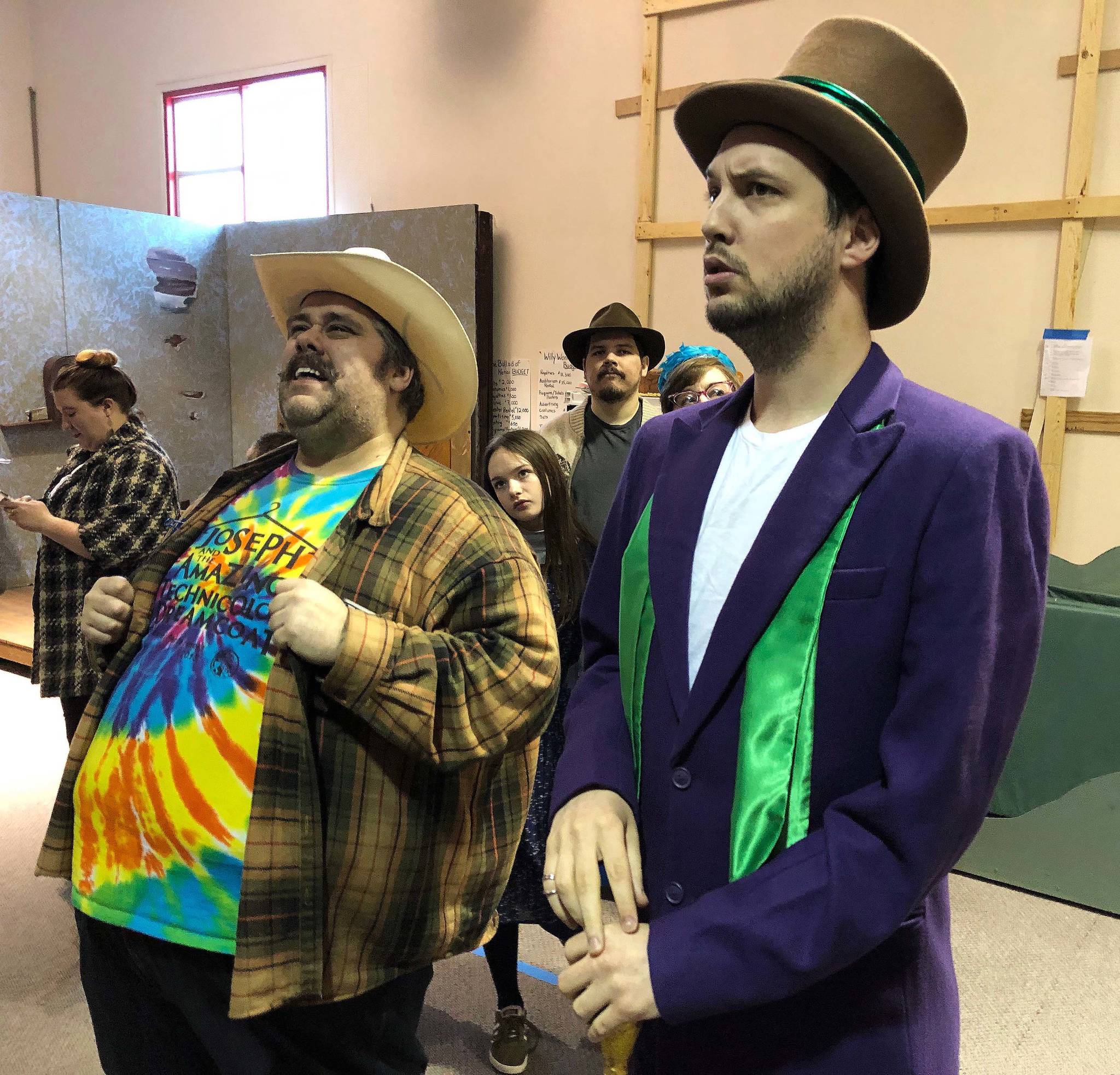 Peninsula actors Ian McEwen (left) and Spencer McAuliffe rehearse a scene from “Willy Wonka” on Saturday, Feb. 9 in Soldotna. McEwen portrays “Mr. Salt”, the enterprising father of one of the lucky golden ticket holders, while McAuliffe plays the eccentric Willy Wonka. (Photo by Joey Klecka)
