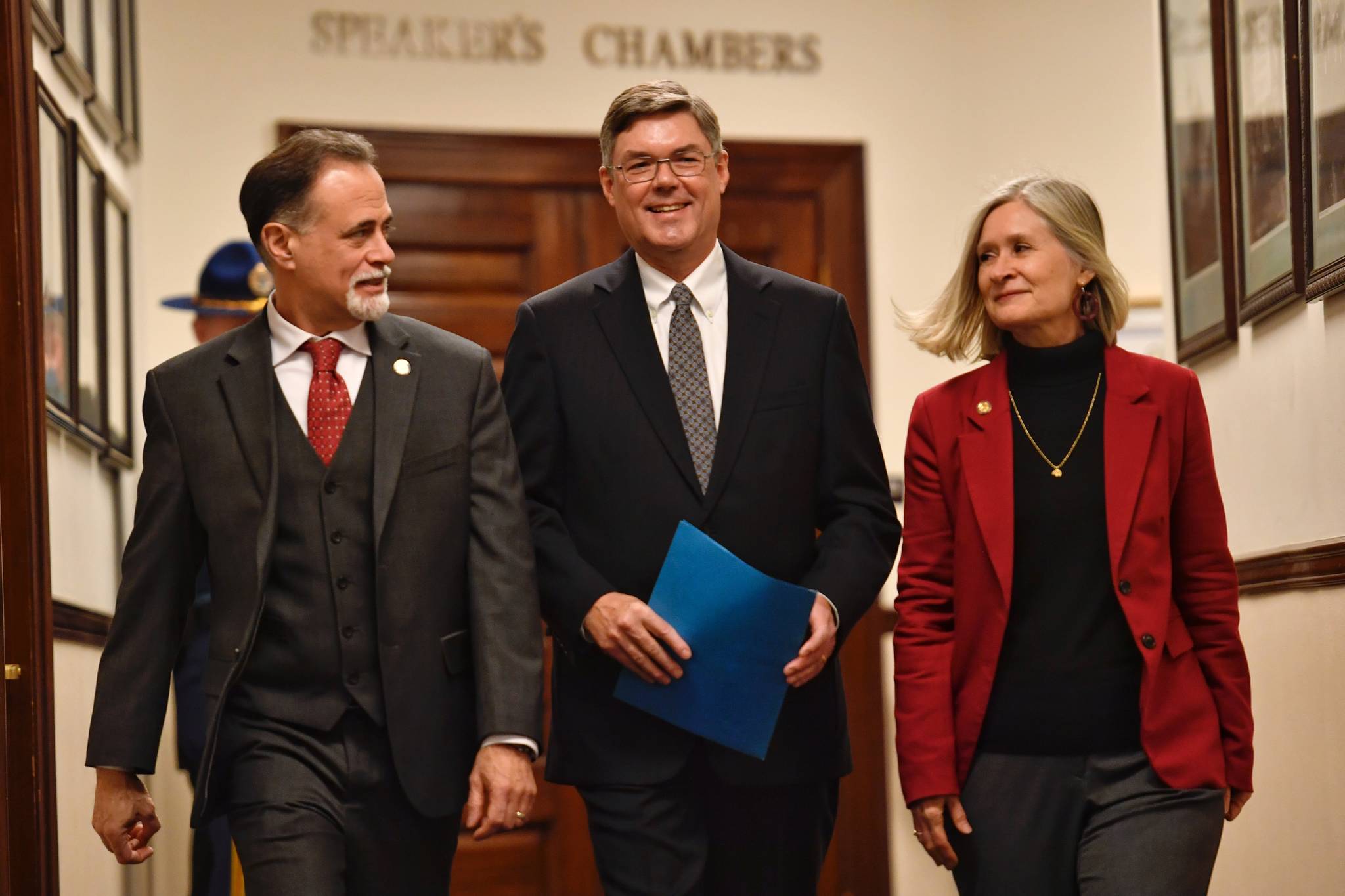 Alaska Supreme Court Chief Justice Joel H. Bolger, center, is escorted to the House of Representatives by Sen. Peter Micciche, R- Soldotna, left, and Rep. Andi Story, D-Juneau, for the annual State of the Judiciary speech at the Capitol on Wednesday, Feb. 20, 2019. (Michael Penn | Juneau Empire)