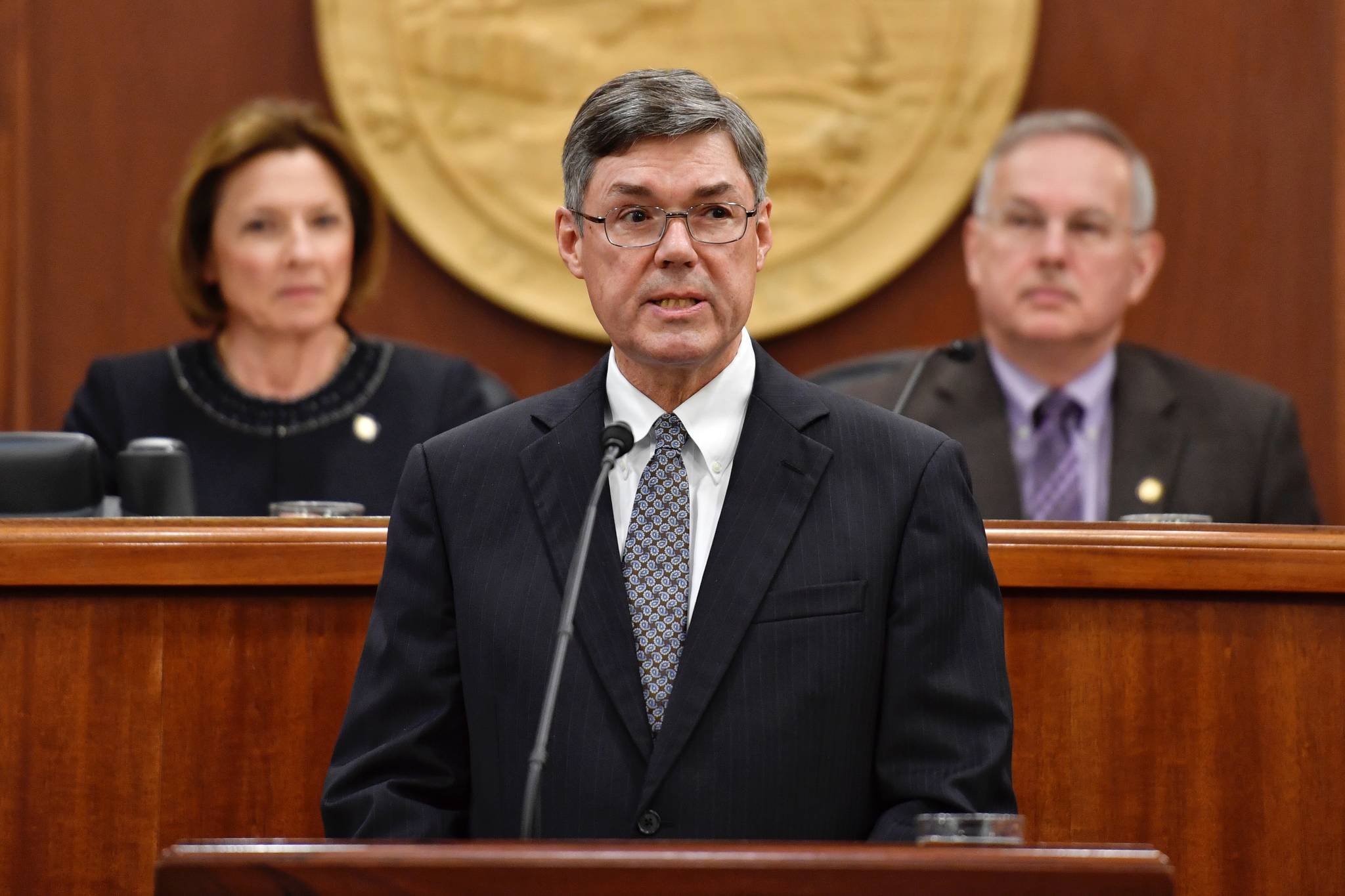 Alaska Supreme Court Chief Justice Joel H. Bolger speaks to a Joint Session of the Alaska Legislature at the Capitol on Wednesday, Feb. 20, 2019. Senate President Cathy Giessel, R-Anchorage, and Speaker of the House Bryce Edgmon, D-Dillingham, listen from the Speaker’s desk in the House of Representatives. (Michael Penn | Juneau Empire)