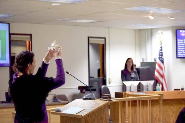 Community member Kalliste Edeen offers an invocation at the Jan. 8 Kenai Peninsula Borough Assembly meeting. (Photo by Brian Mazurek/Peninsula Clarion)