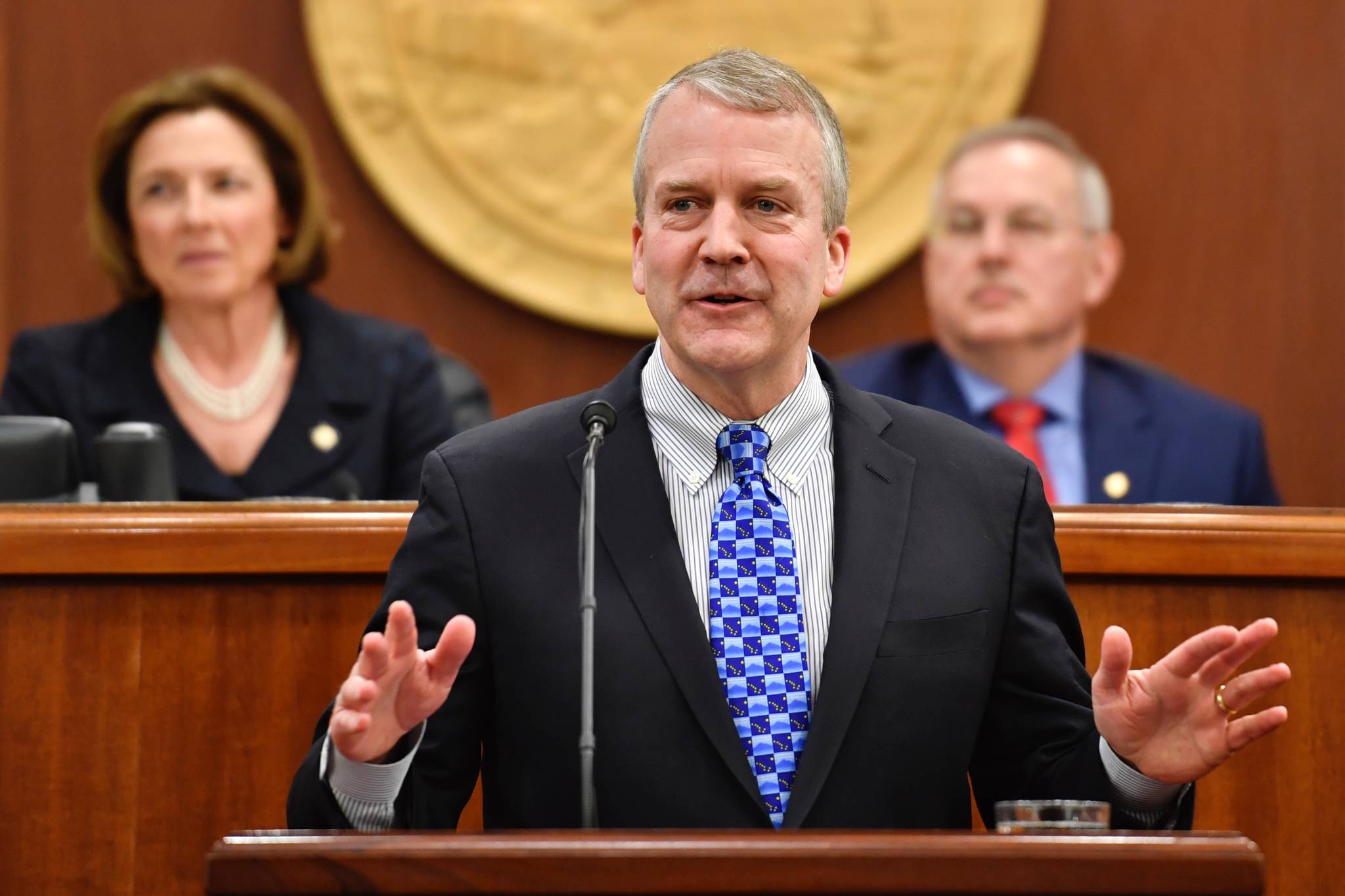 U.S. Sen. Dan Sullivan, R-Alaska, speaks to a Joint Session of the Alaska Legislature at the Capitol on Thursday, Feb. 21, 2019. Senate President Cathy Giessel, R-Anchorage, and Speaker of the House Bryce Edgmon, D-Dillingham, listen from the Speaker’s desk in the House of Representatives. (Michael Penn | Juneau Empire)