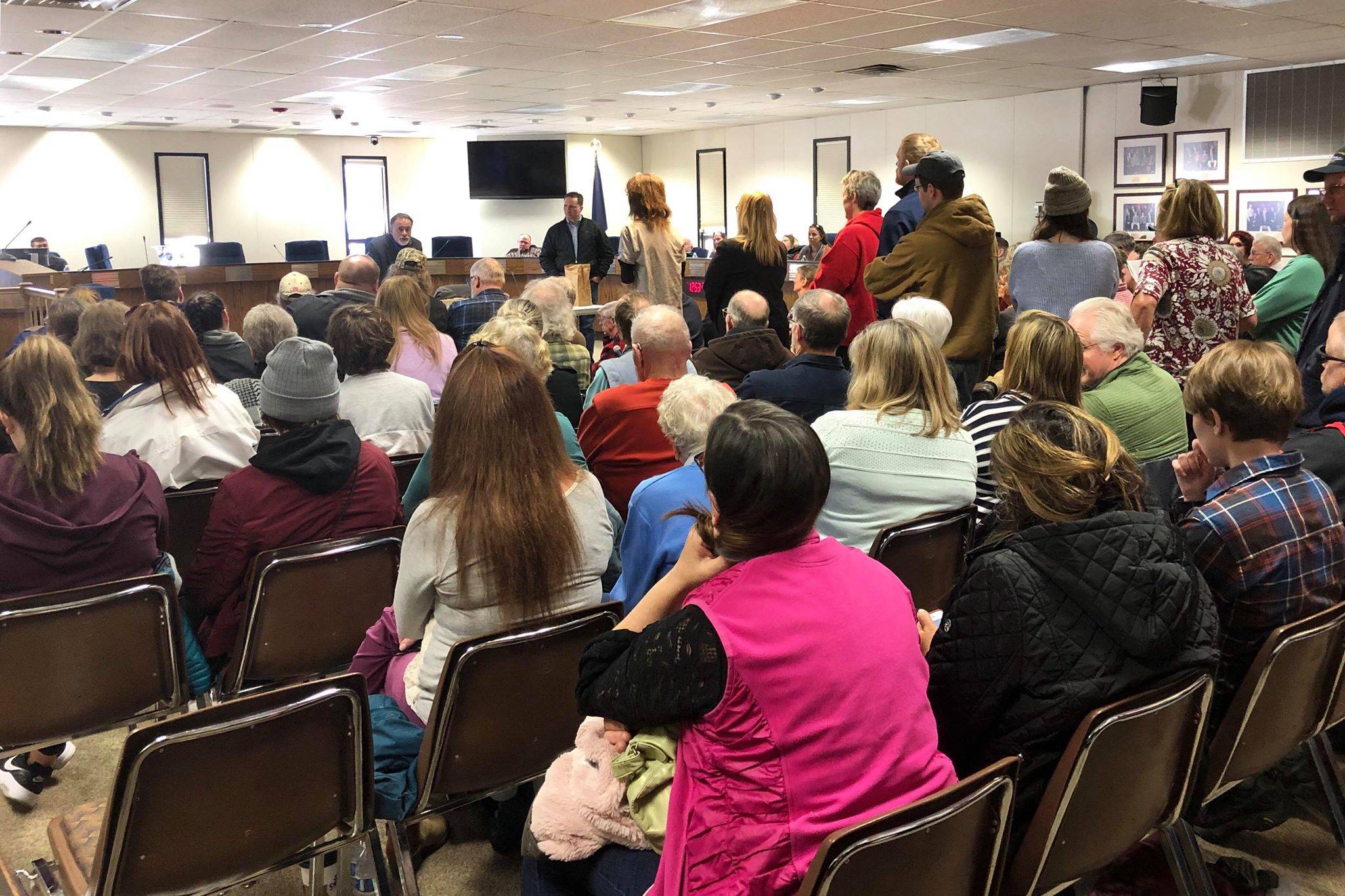 Residents pack into the Kenai Peninsula Borough Betty J. Glick Assembly Chambers for a chance to hear and speak with R-Sen. Peter Micciche (Kenai/Soldotna) and R-Rep. Ben Carpenter (Nikiski) at a town hall meeting, Saturday, Feb. 23, 2019, in Soldotna, Alaska. (Photo by Victoria Petersen/Peninsula Clarion)