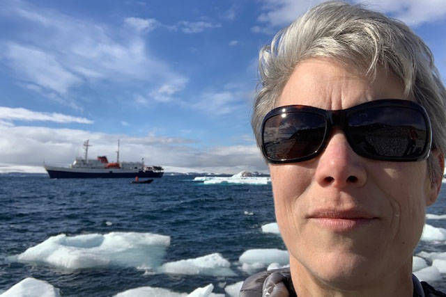 Kristin Mitchell takes a selfie with the MV Ushuaia in the background at Paulette Island on the Antarctic Peninsula on Jan. 4, 2019. (Photo courtesy of Kristin Mitchell)