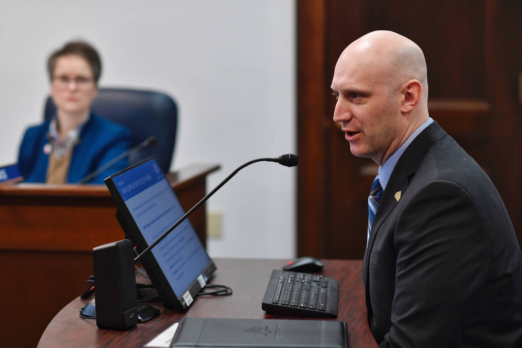 Jeremy Woodrow, interim executive director of the Alaska Seafood Marketing Institute, speaks to the House Fisheries Committee at the Capitol on Tuesday, Feb. 26, 2019. (Michael Penn | Juneau Empire)