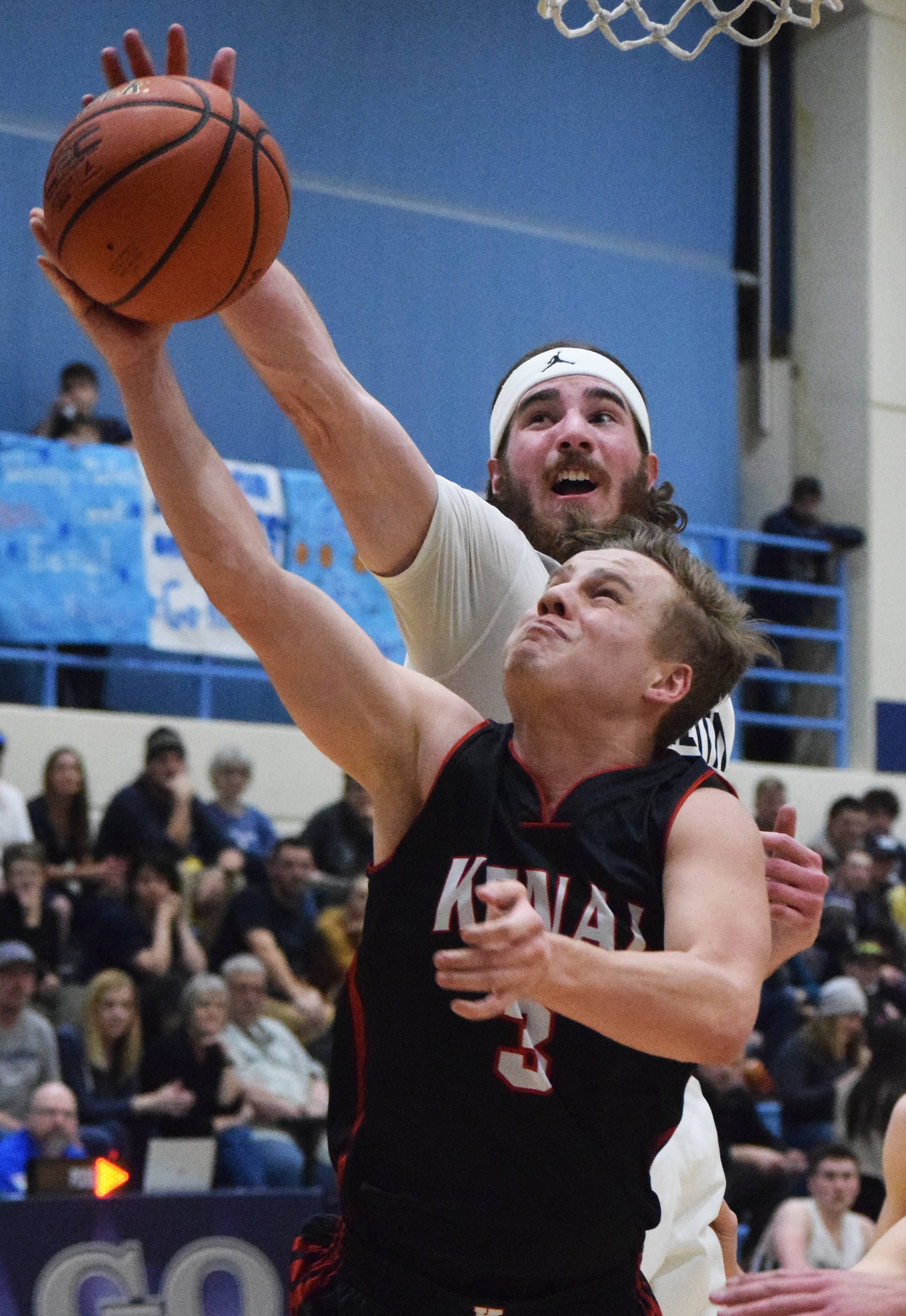 Soldotna’s David Michael (background) puts a block on Kenai’s Connor Felchle Tuesday at Soldotna High School. (Photo by Joey Klecka/Peninsula Clarion)
