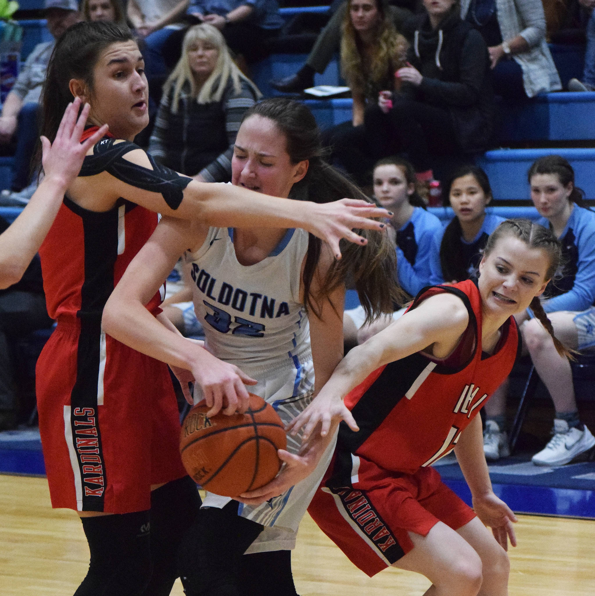 Soldotna’s Danica Schmidt tries to fight out from a trap between Kenai teammates Maddie Galloway (left) and Hayley Maw Tuesday in a nonconference contest at Soldotna High School. (Photo by Joey Klecka/Peninsula Clarion)