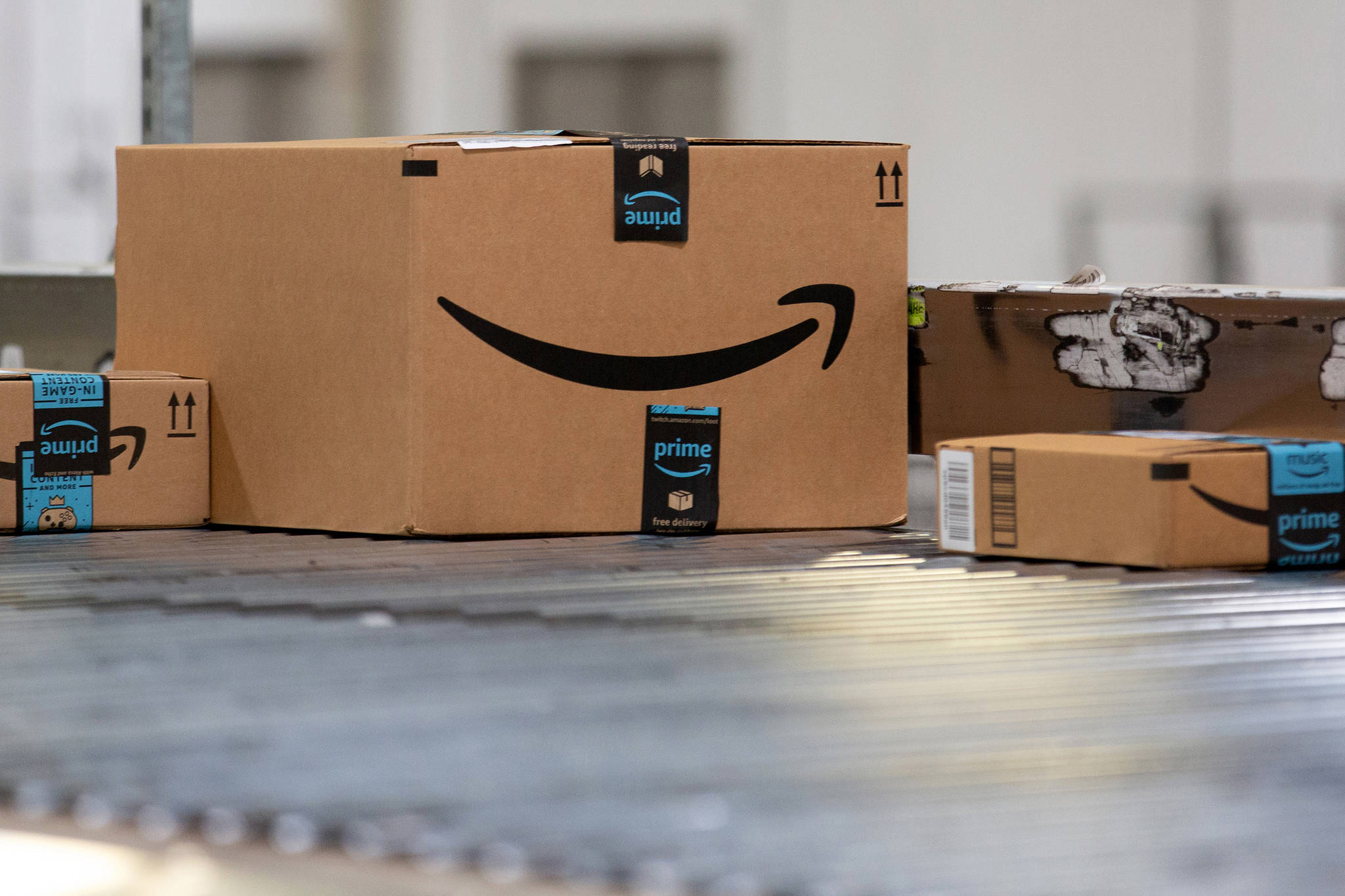 Packages move along a conveyor belt at the Amazon.com fulfillment center in Robbinsville, New Jersey, on June 7. (Bloomberg/Photo by Bess Adler)