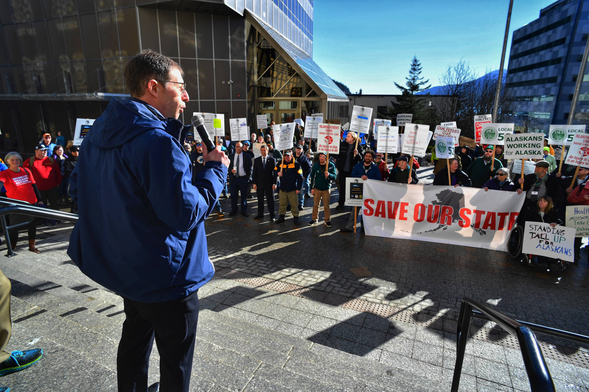 Unions rally outside Capitol, protest job cuts