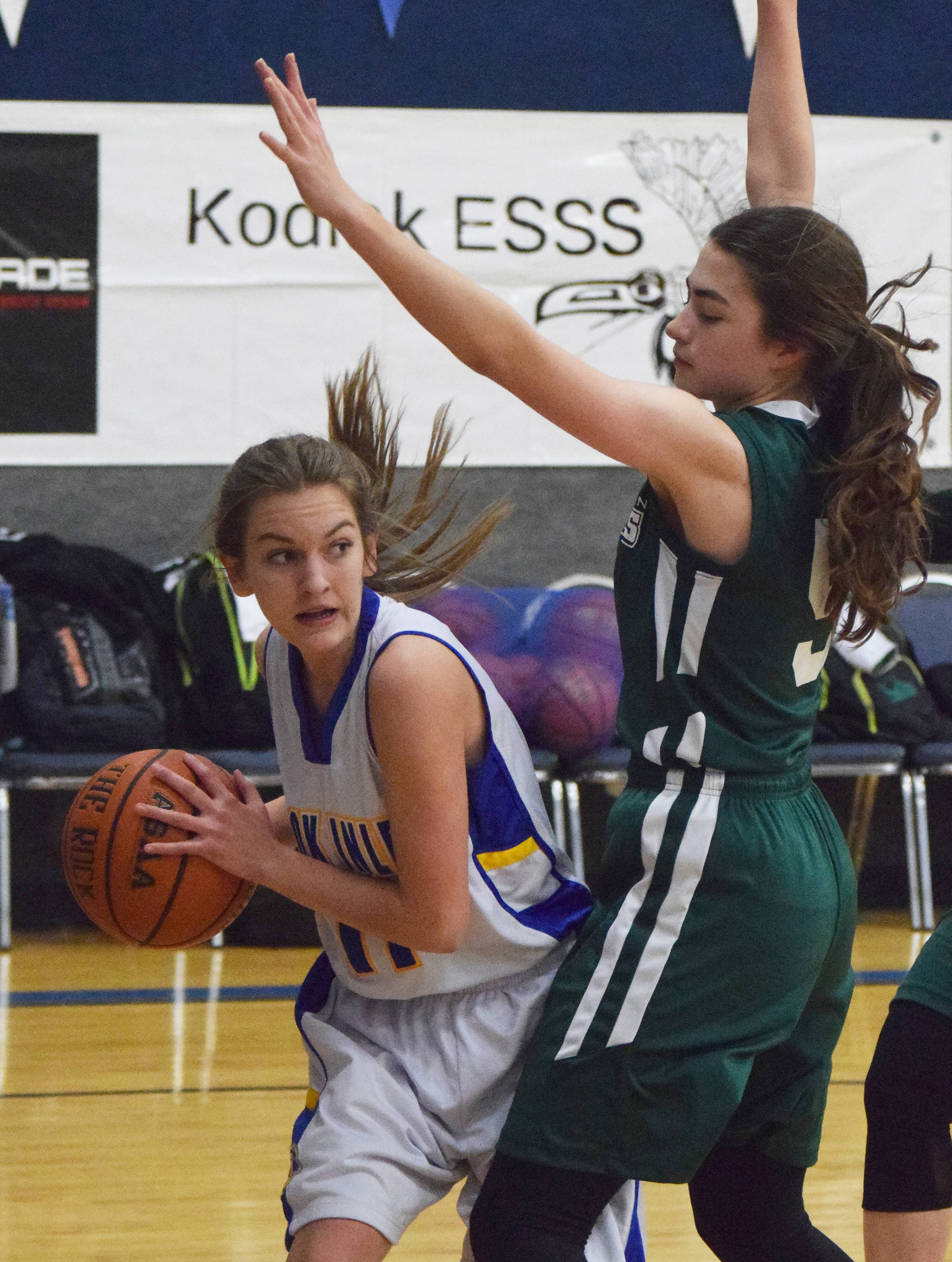 Cook Inlet Academy’s Linnaea Dohse looks for a teammate with Birchwood Christian’s Serena Becker guarding her Wednesday at the 2019 Peninsula Conference championship tournament at Cook Inlet Academy in Soldotna. (Photo by Joey Klecka/Peninsula Clarion)