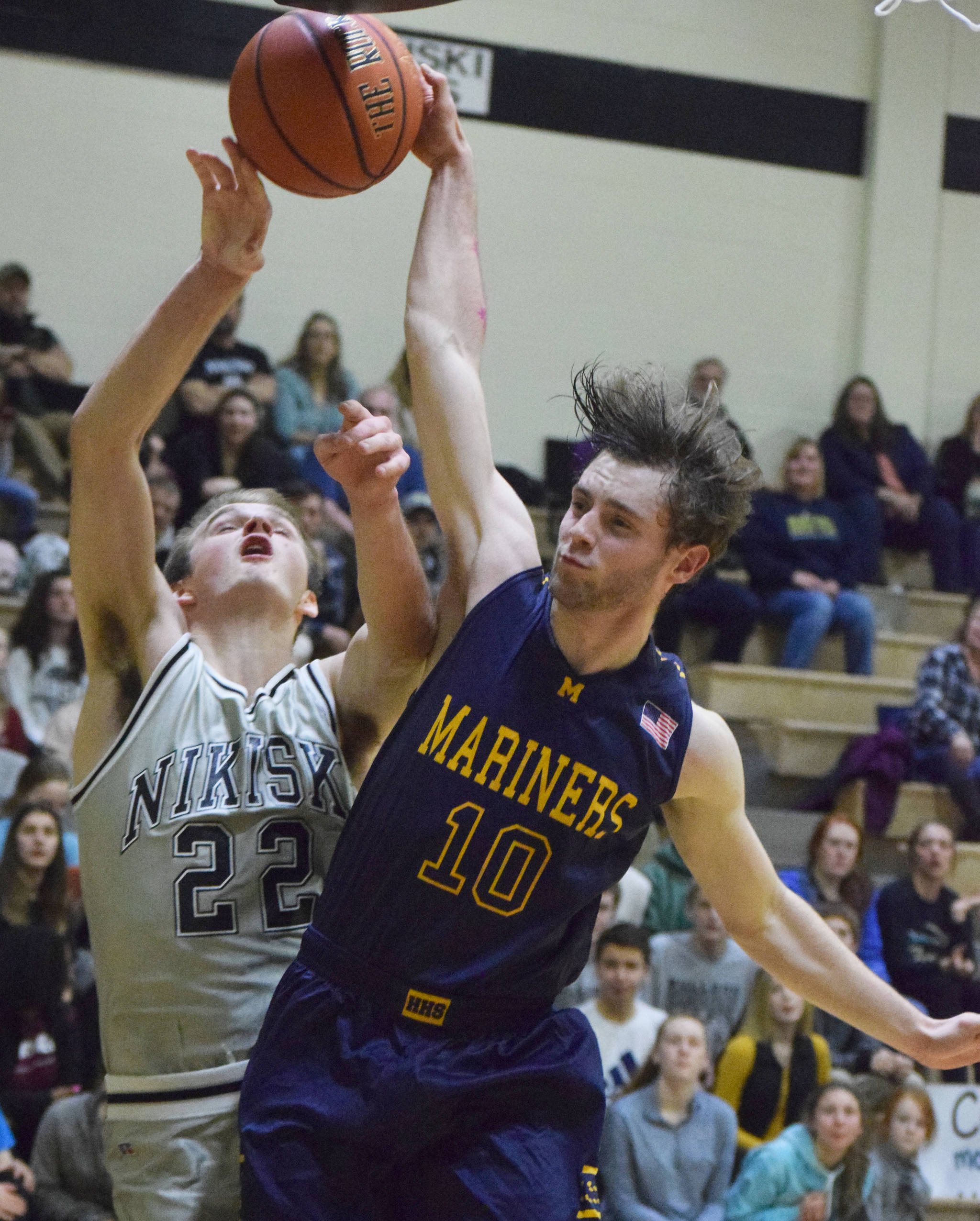 Homer’s Seth Adkins (10) puts a block on Nikiski’s Michael Eiter Friday night in a Southcentral Conference clash at Nikiski High School. (Photo by Joey Klecka/Peninsula Clarion)