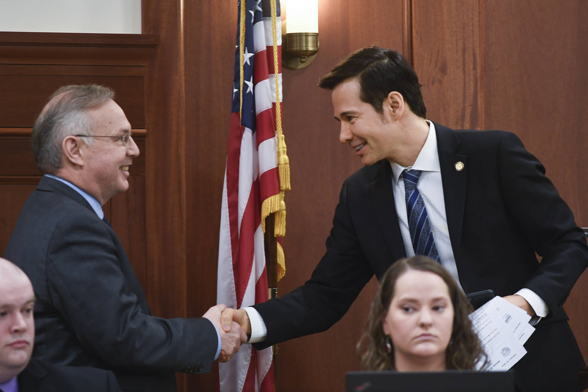 In this February file photo, then-Speaker Pro Tempore Neal Foster, D-Nome, right, shakes hands with newly elected Speaker of the House Bryce Edgmon, D-Dillingham, in the House. (Michael Penn | Juneau Empire)