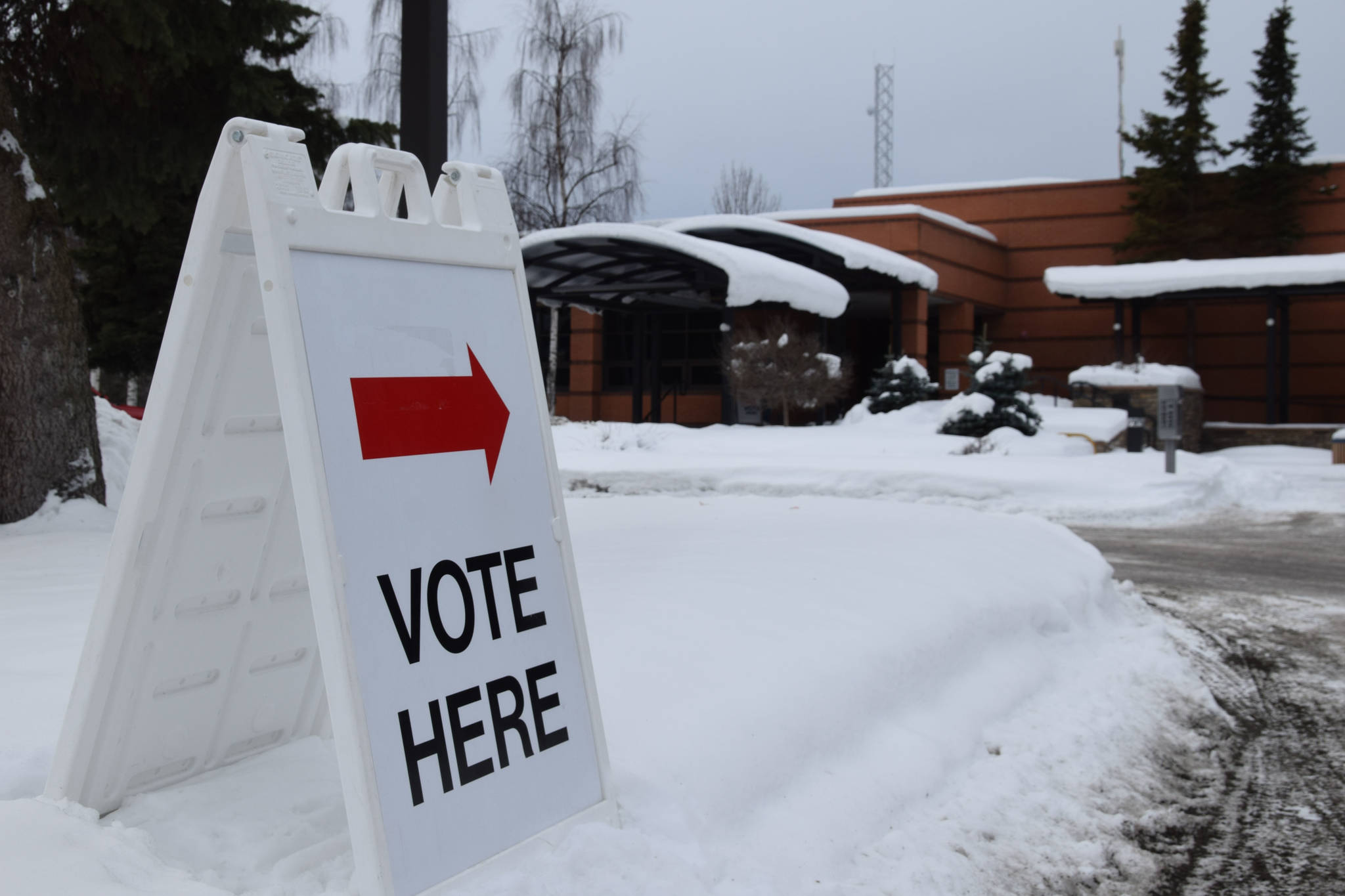 A sign directing voters to the polling place sits outside city hall in Soldotna on March 5, 2019. (Photo by Brian Mazurek/Peninsula Clarion)