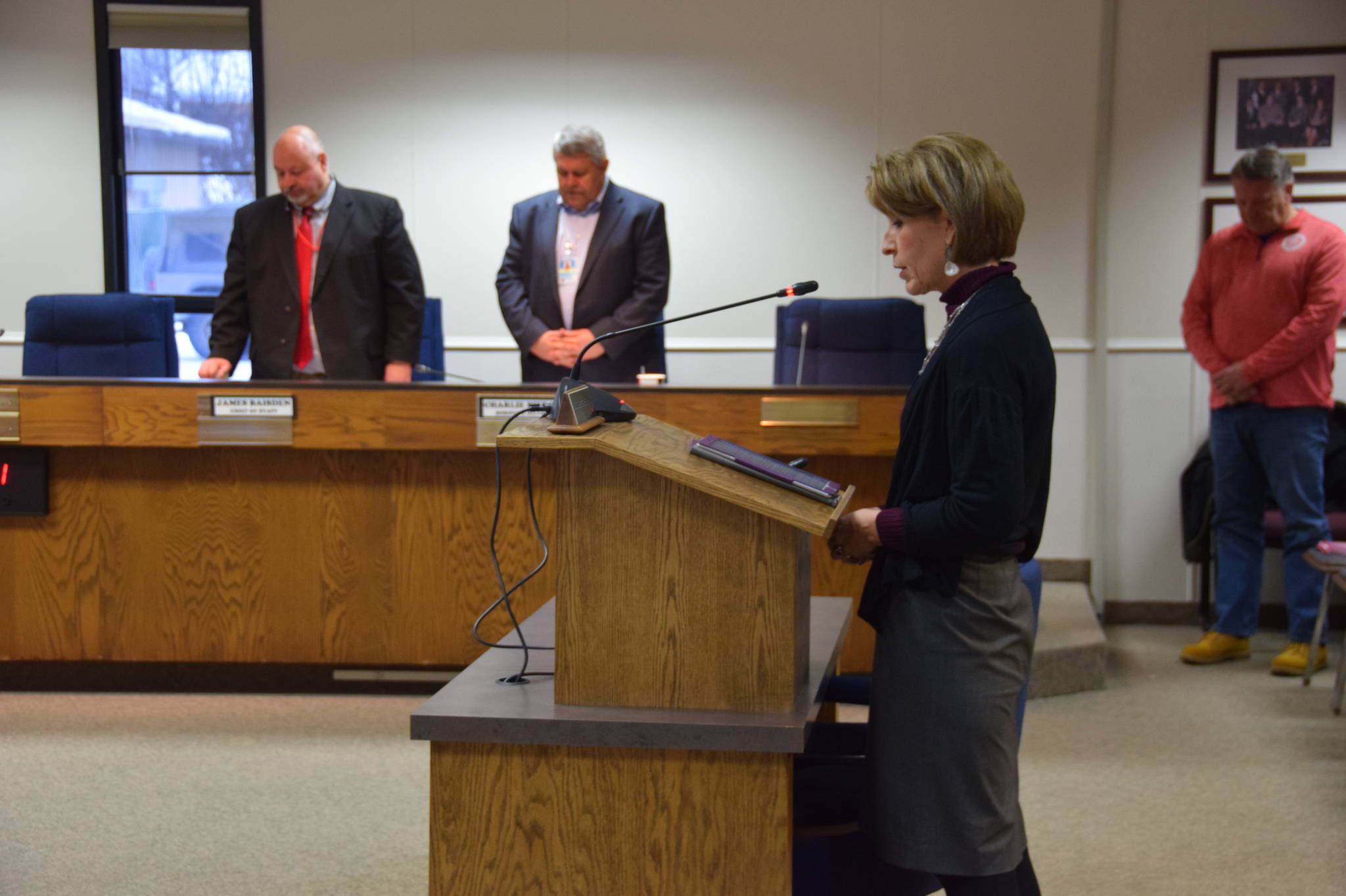 An invocation is given by Debbie Hamilton at the Kenai Peninsula Borough Assembly Meeting in Soldotna on March 5, 2019. (Photo by Brian Mazurek/Peninsula Clarion)