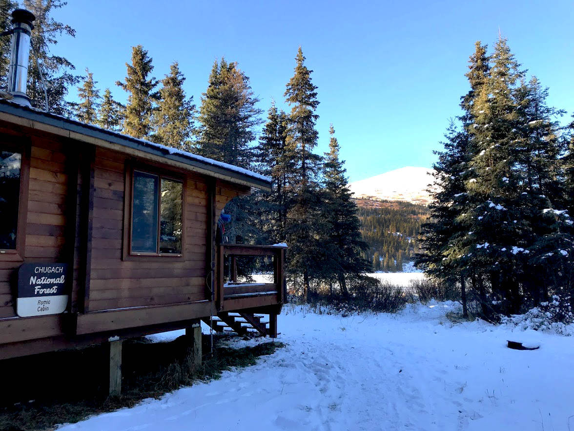 Romig Cabin, a public-use cabin on Juneau Lake, is seen here in November 2017. The cabin can be rented online at recreation.gov and can be accesed by hiking, biking, skiing and horseback. (Photo by Kat Sorensen/Peninsula Clarion)