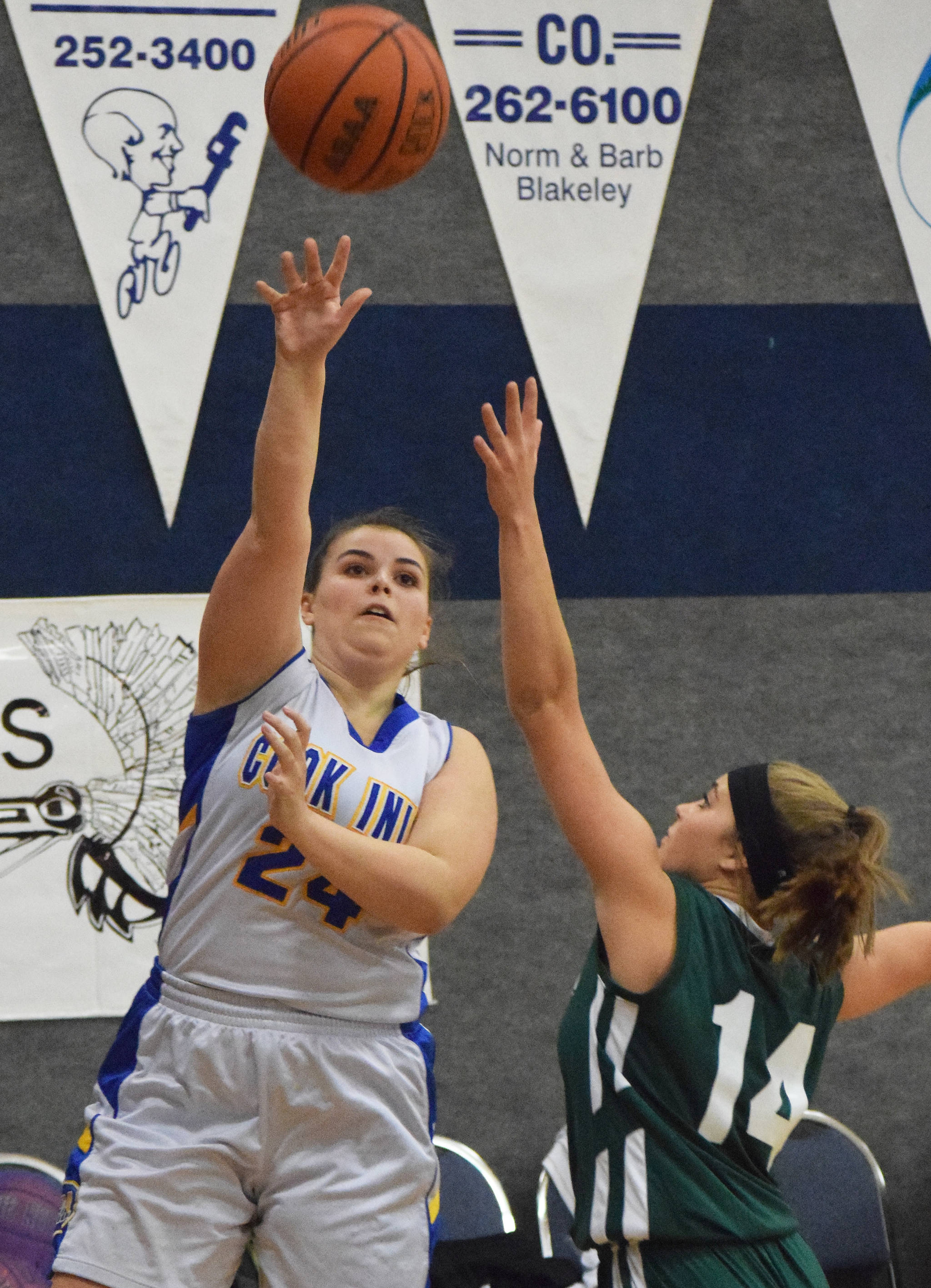 Cook Inlet Academy’s Anna Cizek (24) takes a shot in front of Birchwood Christian defender Kailyn Kaas Feb. 27, 2019, at the 2019 Peninsula Conference championship tournament at Cook Inlet Academy in Soldotna. (Photo by Joey Klecka/Peninsula Clarion)