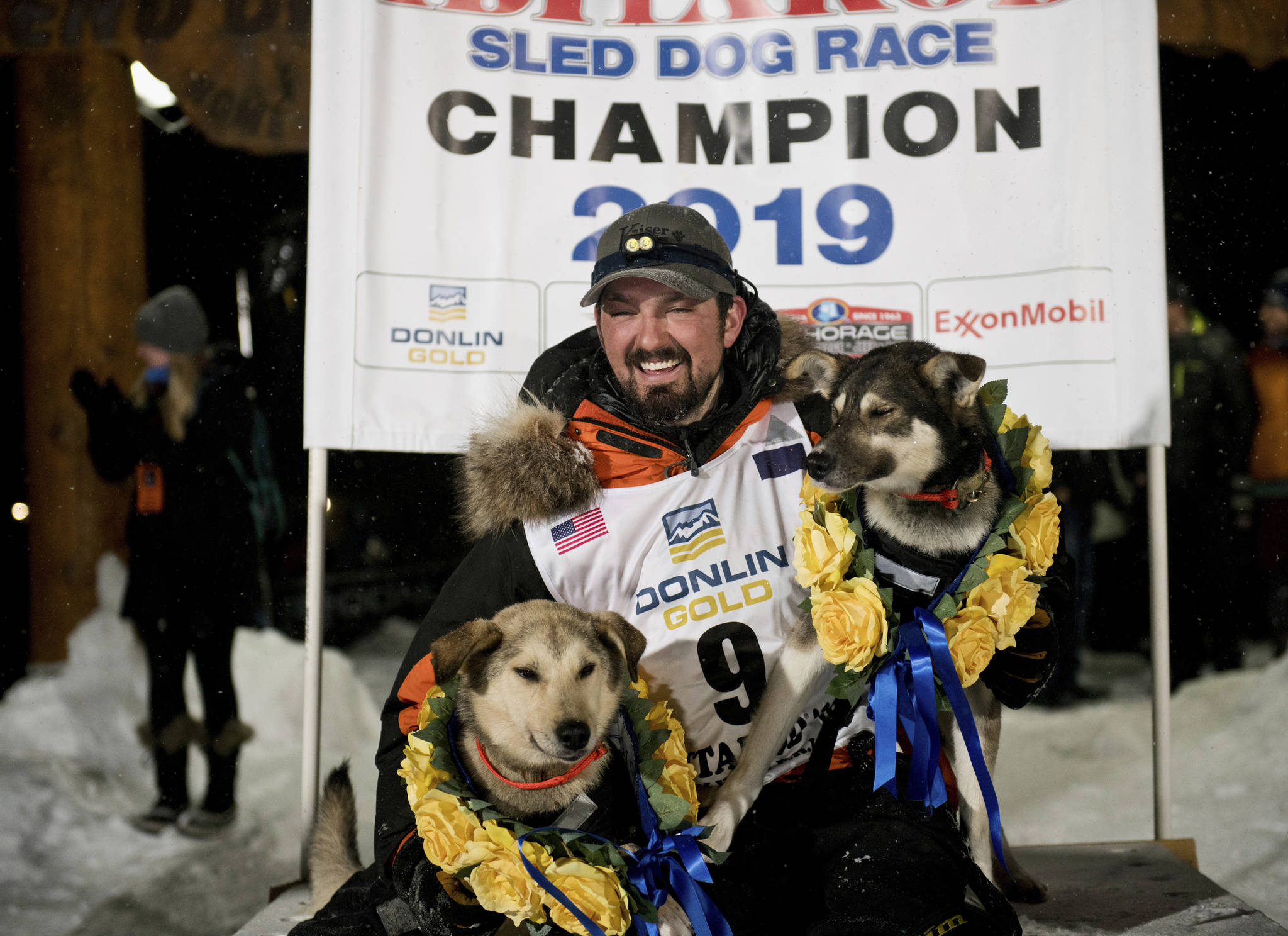 Peter Kaiser (9) poses with his lead dogs, Morrow, left, and Lucy., Wednesday, March 13, 2019, in Nome, Alaska, after winning the Iditarod Trail Sled Dog Race. It’s the first Iditarod victory for Kaiser in his 10th attempt. (Marc Lester/Anchorage Daily News via AP)