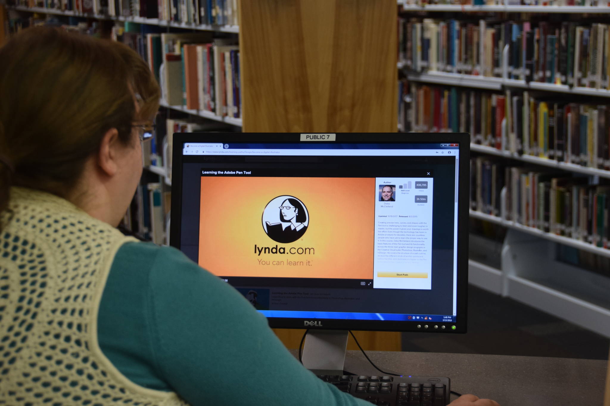 Kenai librarian Bethany McMilin demonstrates how to use Lynda.com, an online learning resource available for free through the public library system, at the Kenai Community Library on Wednesday. (Photo by Brian Mazurek/Peninsula Clarion)