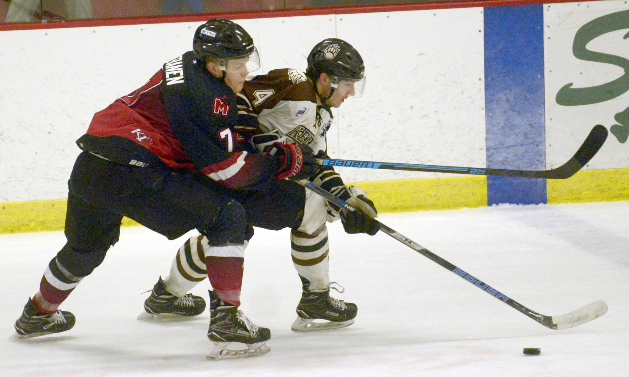 Minnesota Magicians forward John Keranen and Kenai River Brown Bears defenseman Connor Canterbury battle for the puck Friday, March 15, 2019, at the Soldotna Regional Sports Complex. (Photo by Jeff Helminiak/Peninsula Clarion)