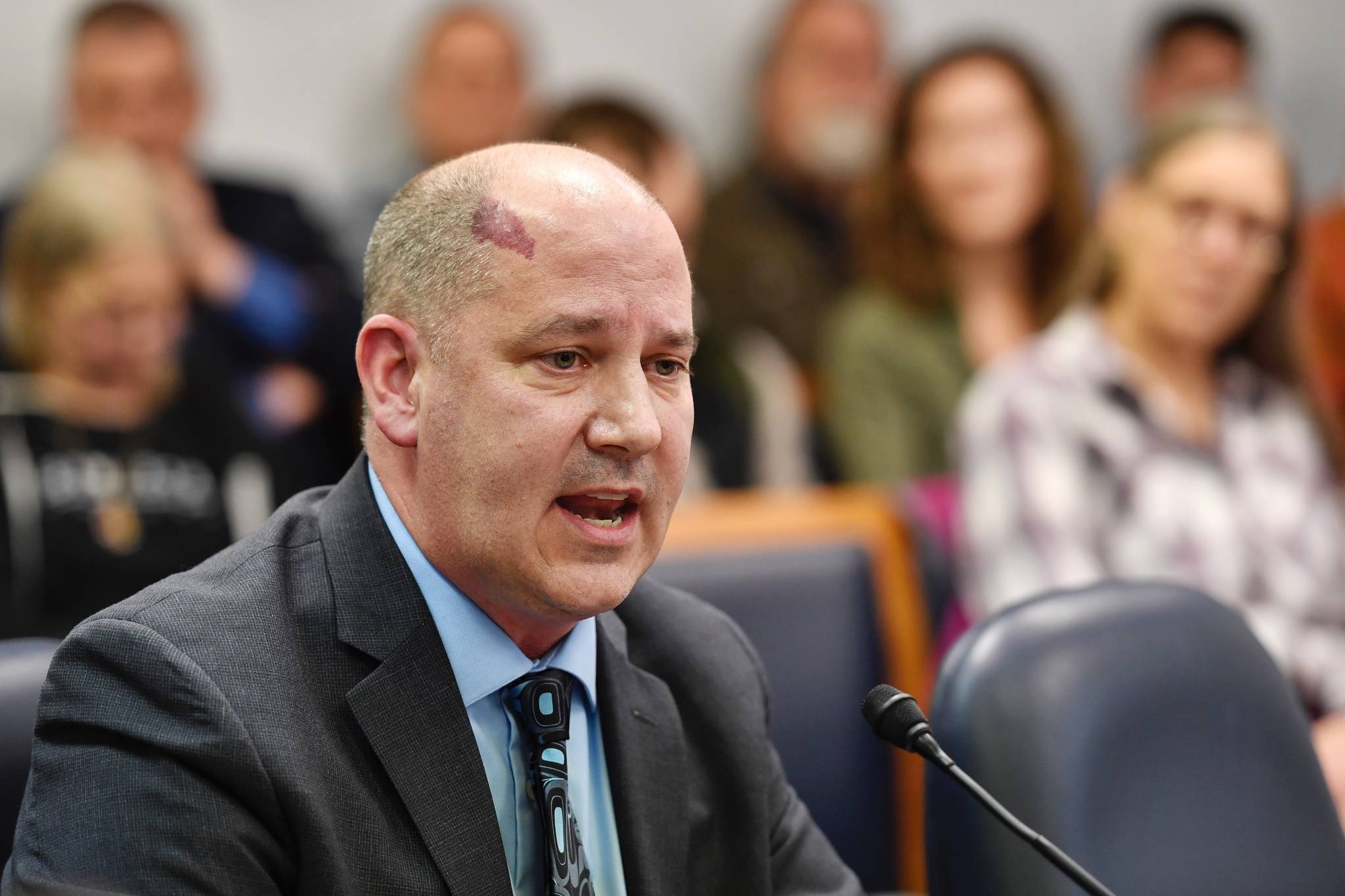 Jason Brune, Commissioner designee for the Department of Conservation, speaks to the House Resources Committee at the Capitol on Friday, March 14, 2019. (Michael Penn | Juneau Empire)
