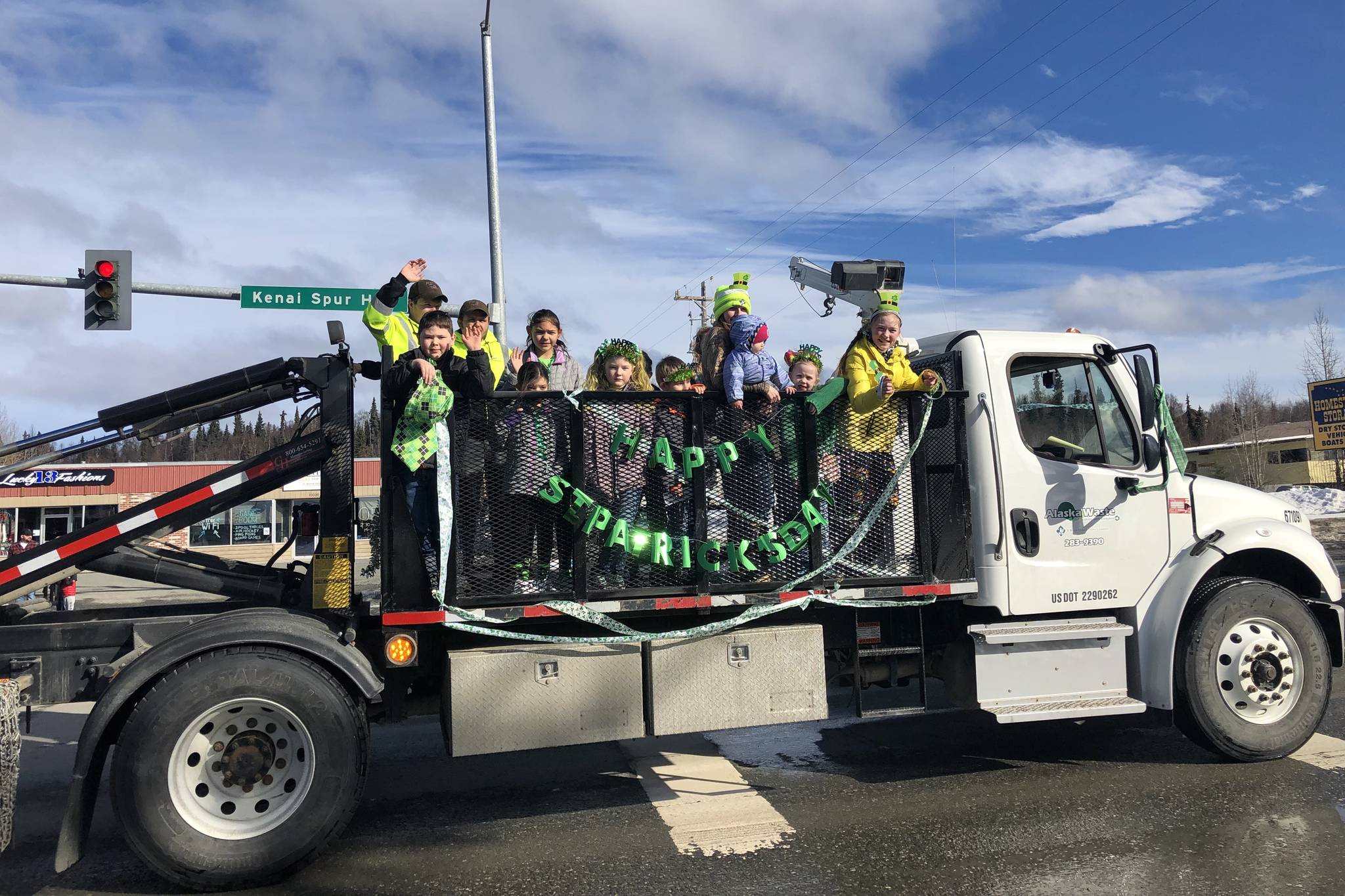 Residents in the parade wave to passerbys at the 28th annual Soldotna St. Patrick’s Day Parade on March, 17, 2019, in Soldotna, Alaska. (Photo by Victoria Petersen/Peninsula Clarion)