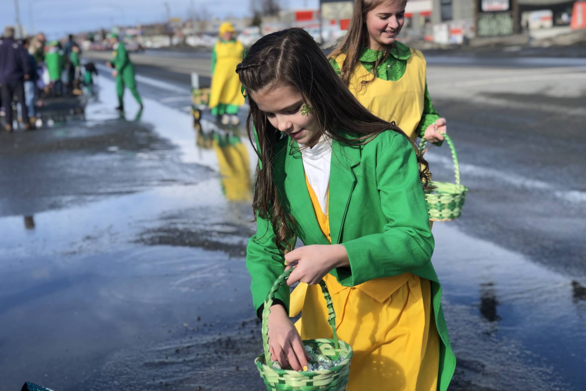 A parade participant passes out candy at Soldotna’s St. Patrick’s Day Parade on Sunday, March 17, 2019, in Soldotna, Alaska. (Photo by Victoria Petersen/Peninsula Clarion)
