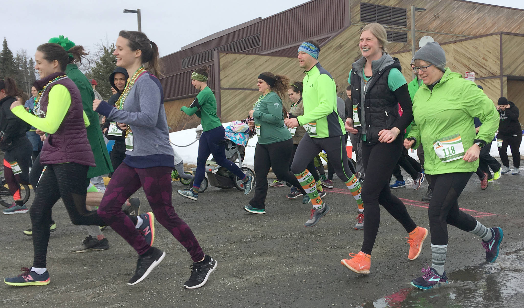 Runners take off at the start of the Shamrock Shuffle on Sunday, March 17, 2019, at the Soldotna Regional Sports Complex. (Photo by Jeff Helminiak/Peninsula Clarion)