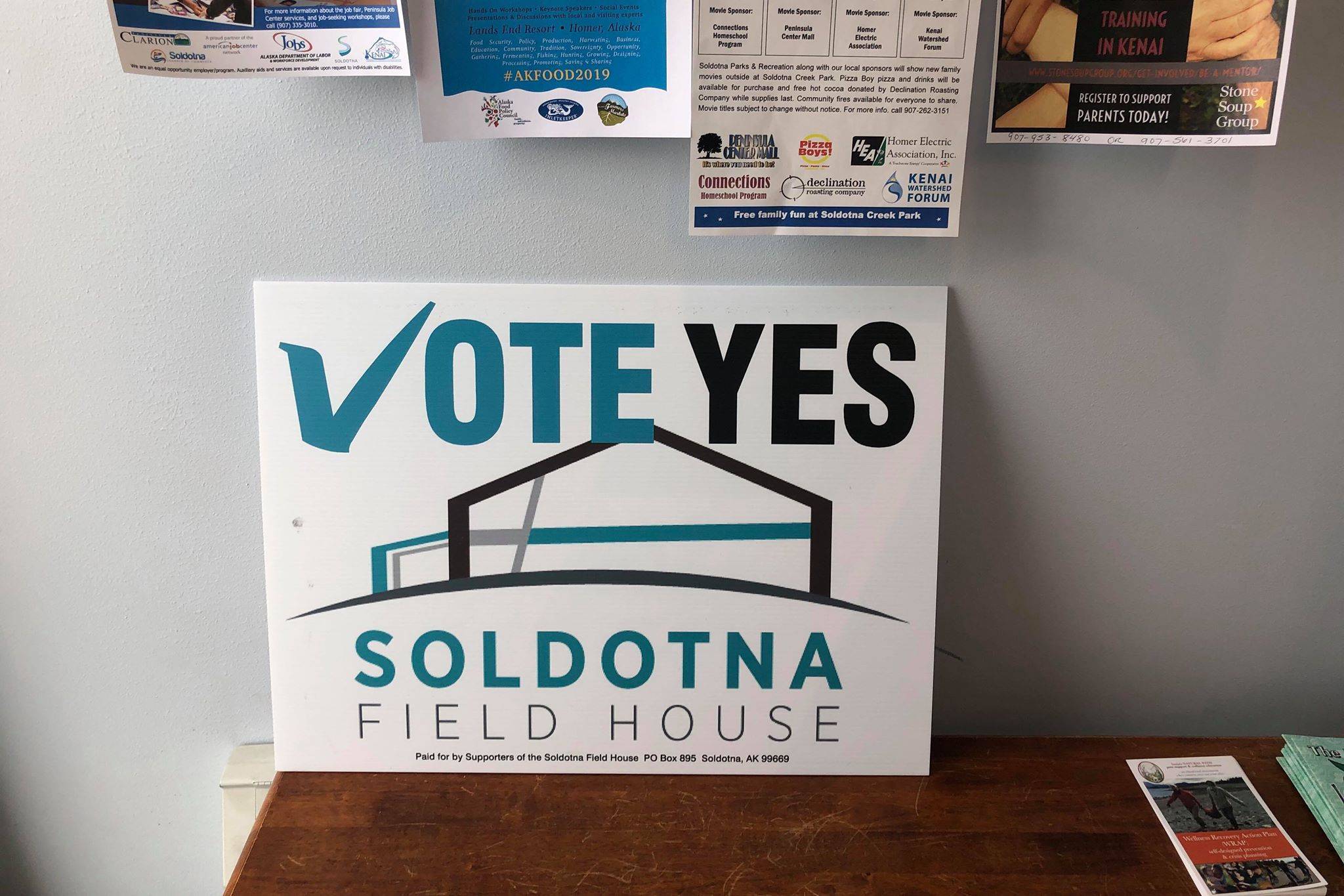 A sign supporting the field house proposition sits inside local cafe, Everything Bagels, in Soldotna, Alaska, on Wednesday, Feb. 27, 2019. (Photo by Victoria Petersen/Peninsula Clarion)