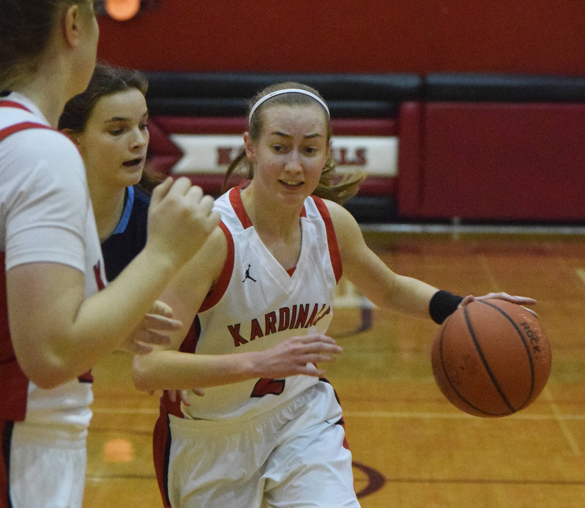 Kenai’s Jaycie Calvert drives into the paint against Soldotna’s Morgan Bouschor Saturday, Feb. 23, 2019, in a nonconference clash at Kenai Central High School. (Photo by Joey Klecka/Peninsula Clarion)