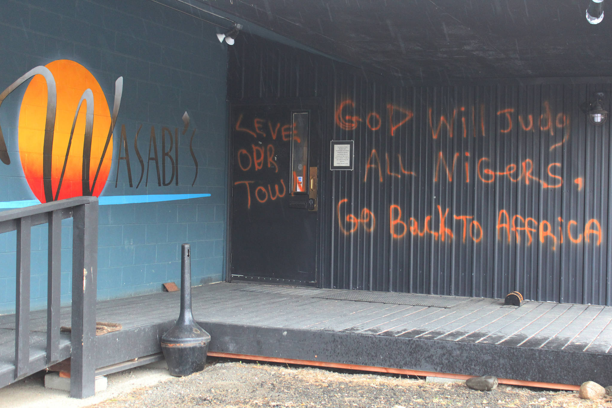 Racist messages are spray painted onto a wall at Wasabi’s Bistro, shown here Thursday, March 21, 2019 just outside of Homer, Alaska. (Photo by Megan Pacer/Homer News)