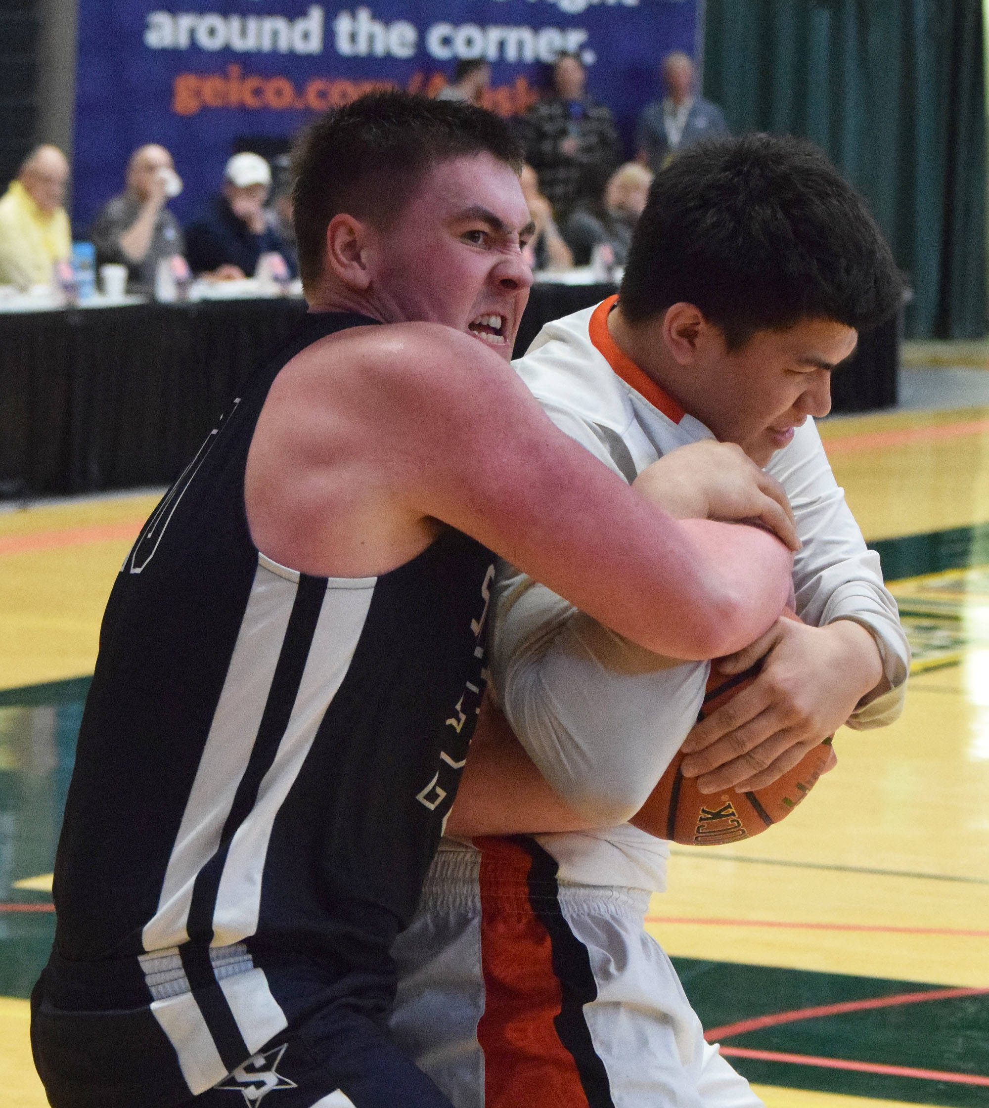 Soldotna’s Brock Kant (left) wrestles with West’s Anthony Snow for a rebound Thursday, Mar. 21, 2019, at the Class 4A state championship tournament at the Alaska Airlines Center in Anchorage. (Photo by Joey Klecka/Peninsula Clarion)